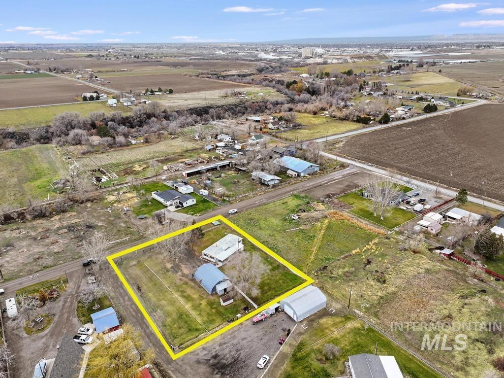 Overview of rural landscape featuring property boundaries highlighted and abundant farmland
