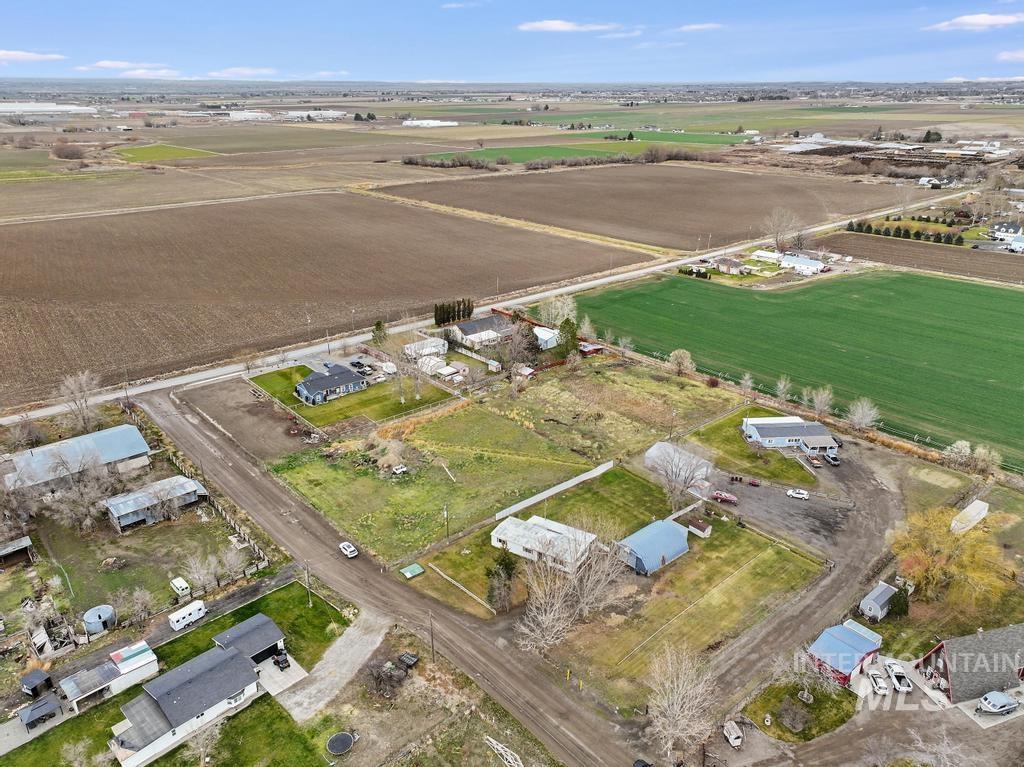 View of property location with rural landscape and rows of crops