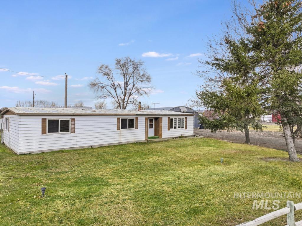 Ranch-style house with a front lawn