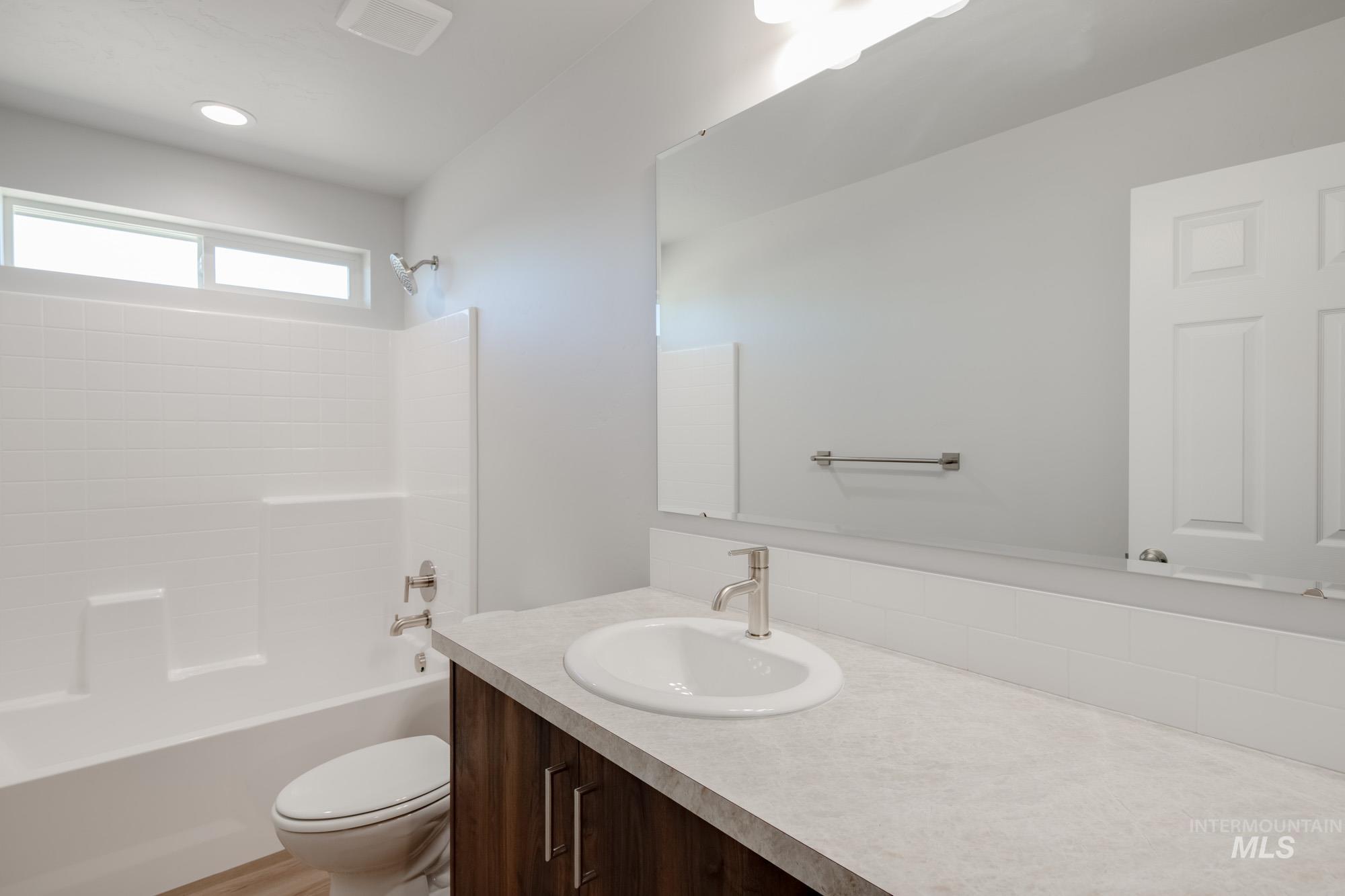 Full bath with  shower combination and vanity