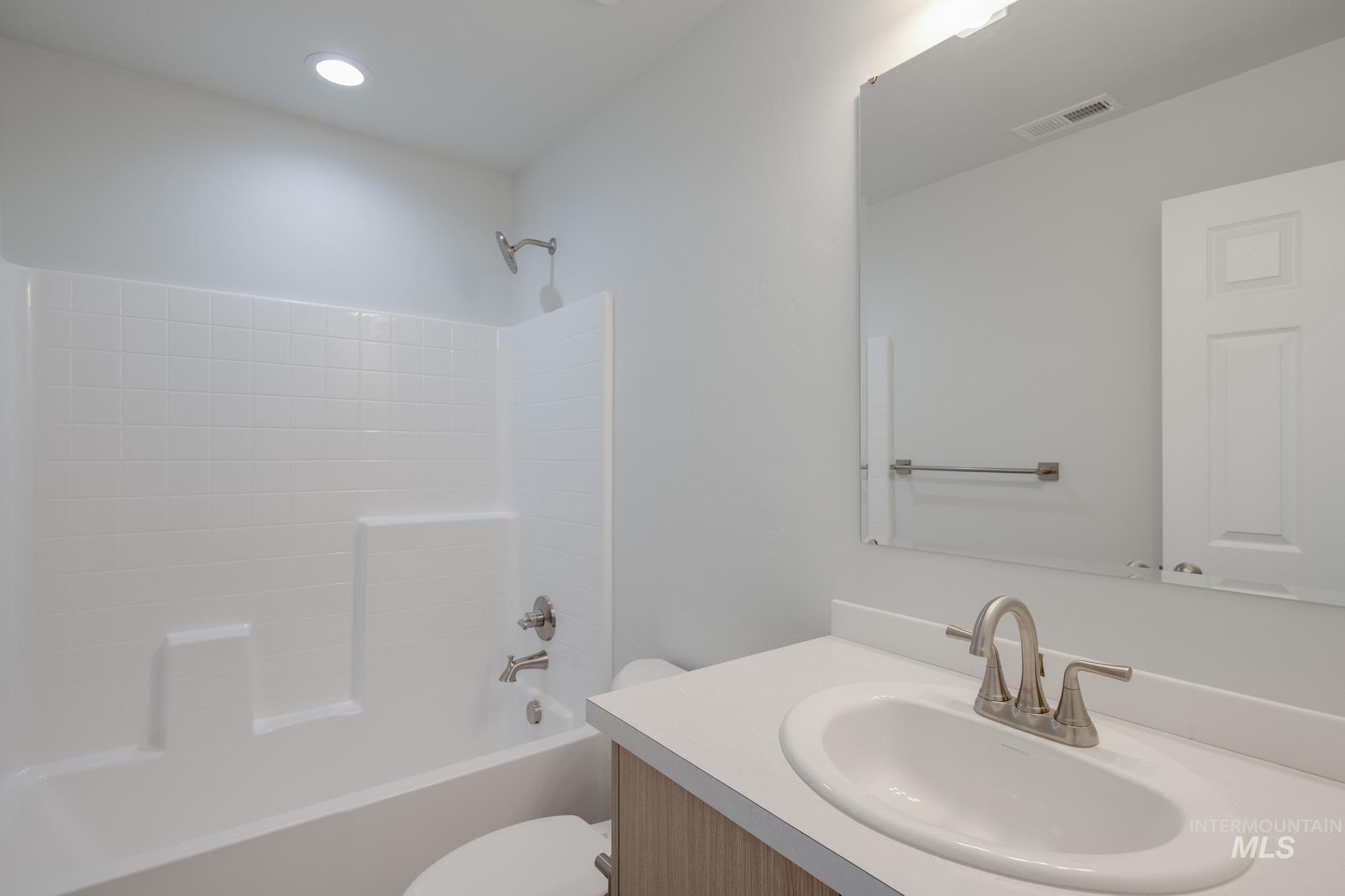 Full bathroom with bathtub / shower combination and vanity