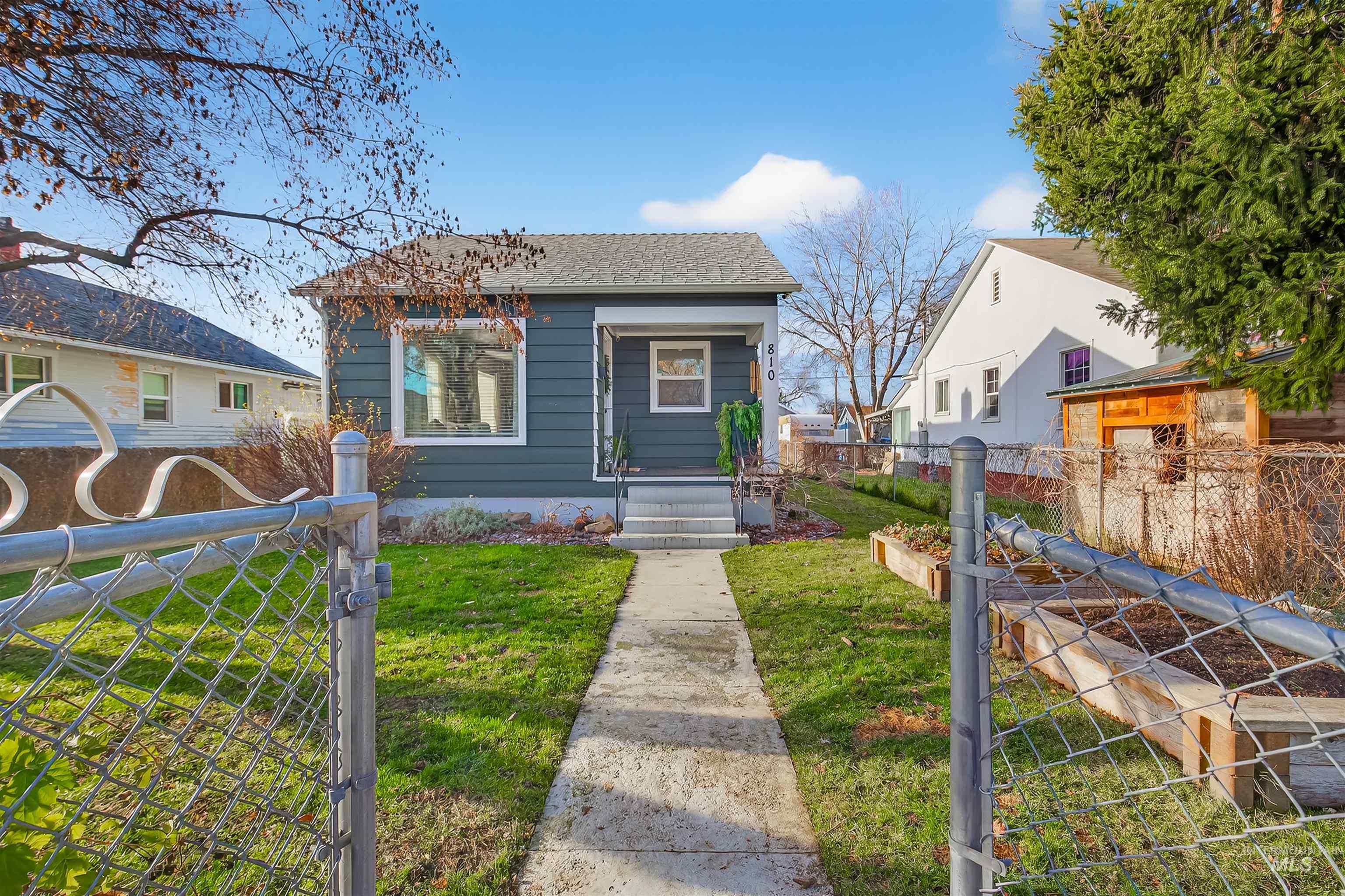 Bungalow-style house with a gate
