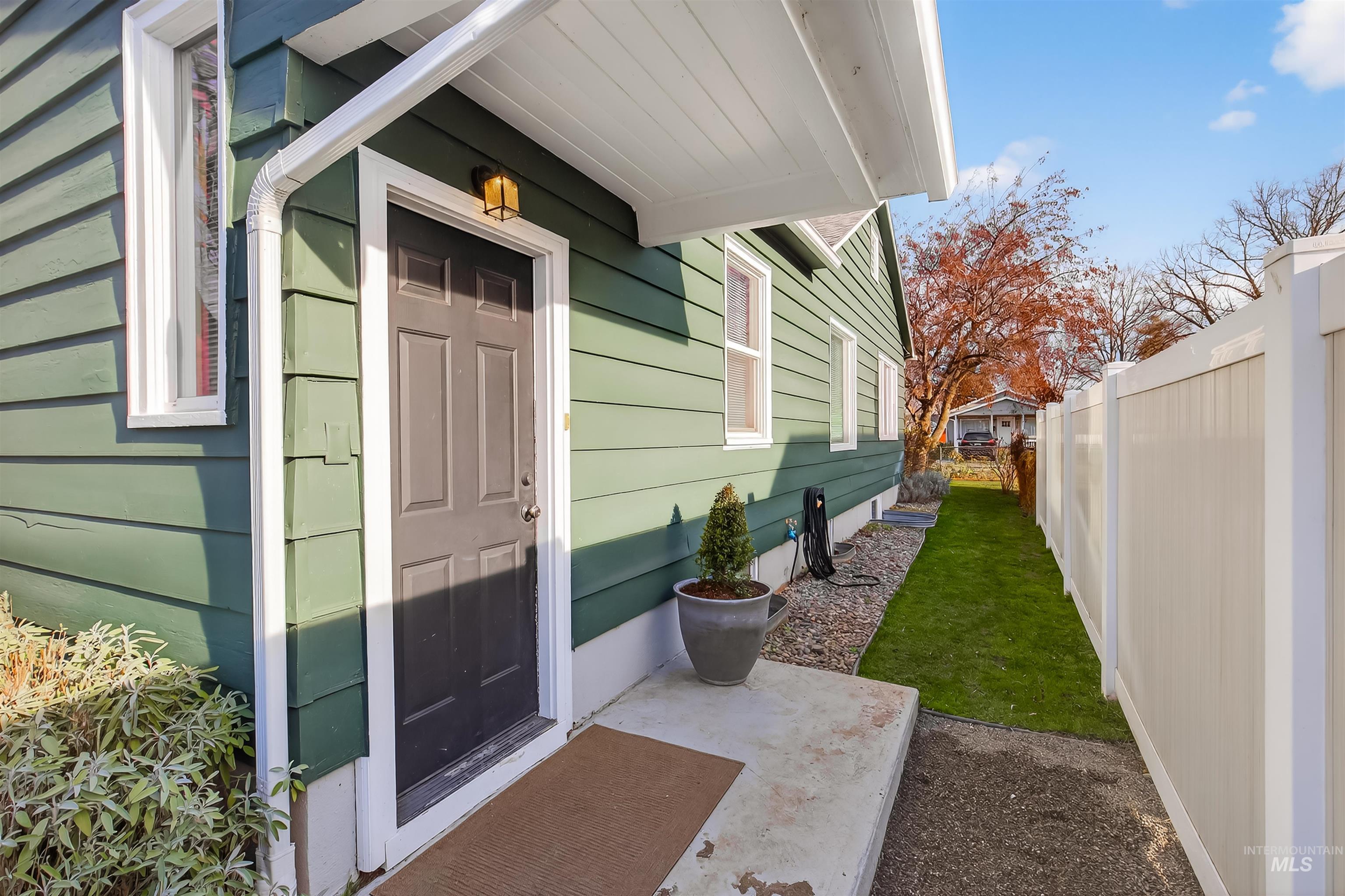 Doorway to property with a patio