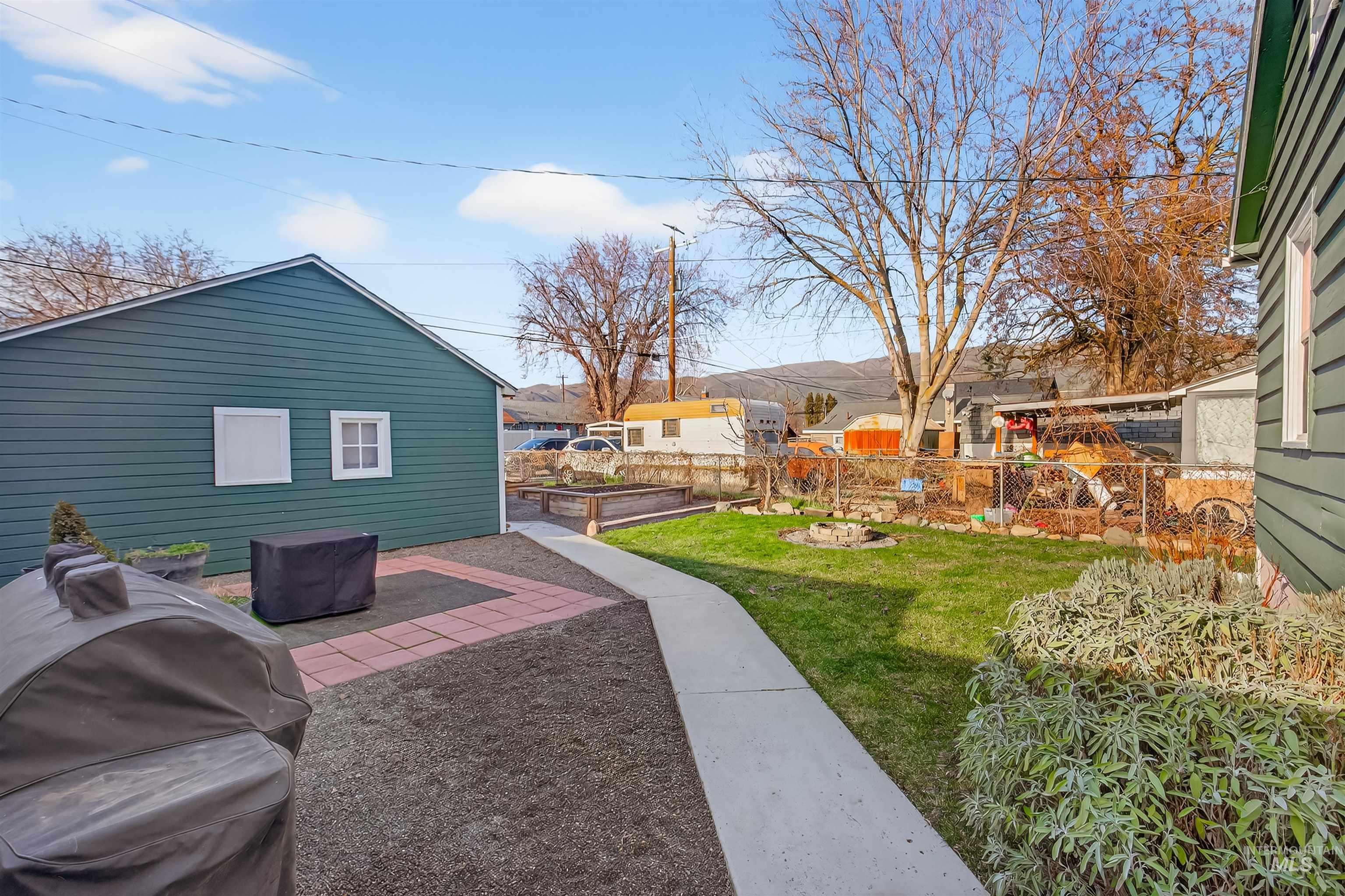 View of yard with a patio area and a residential view