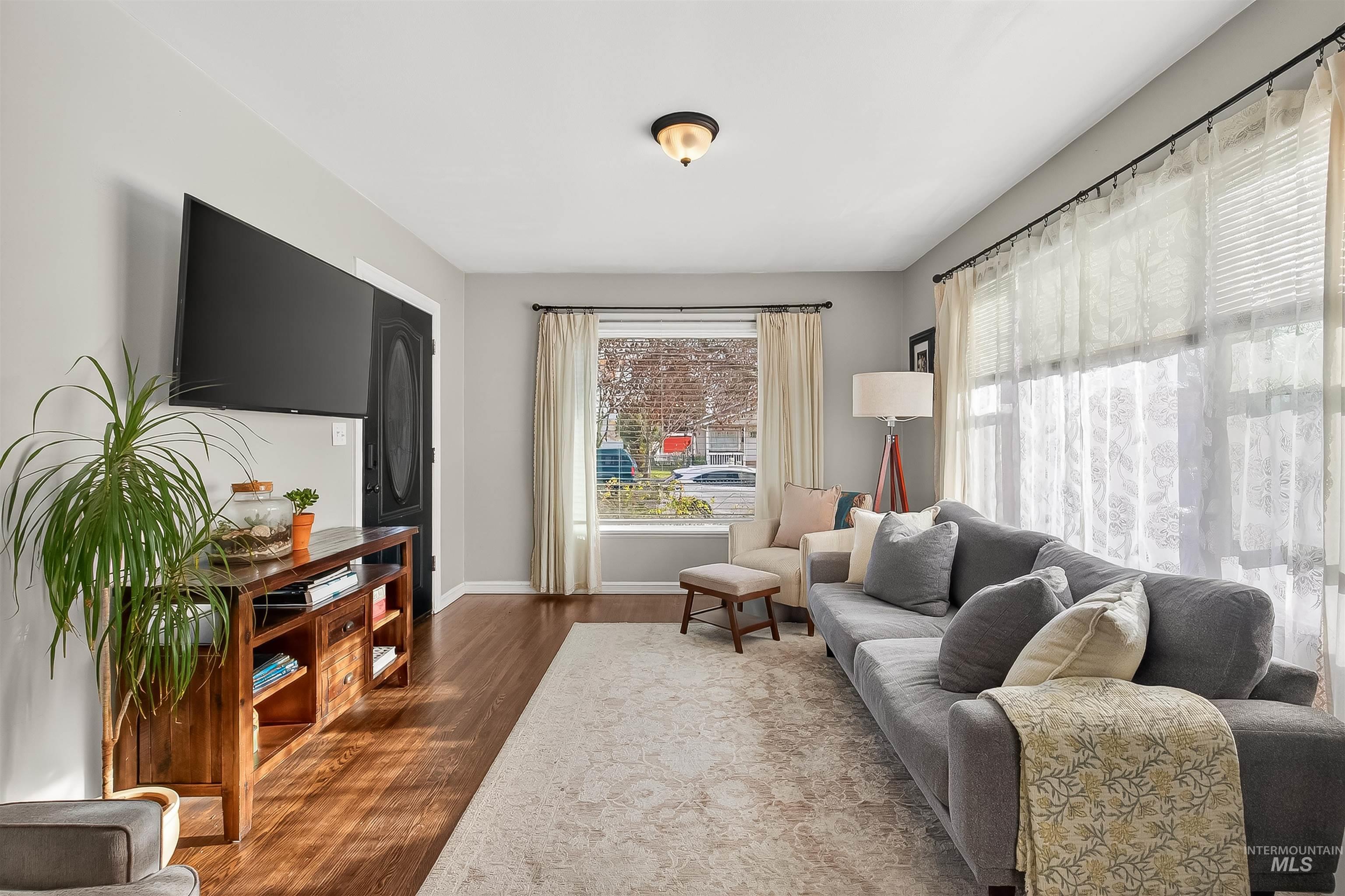 Living room featuring wood finished floors and baseboards