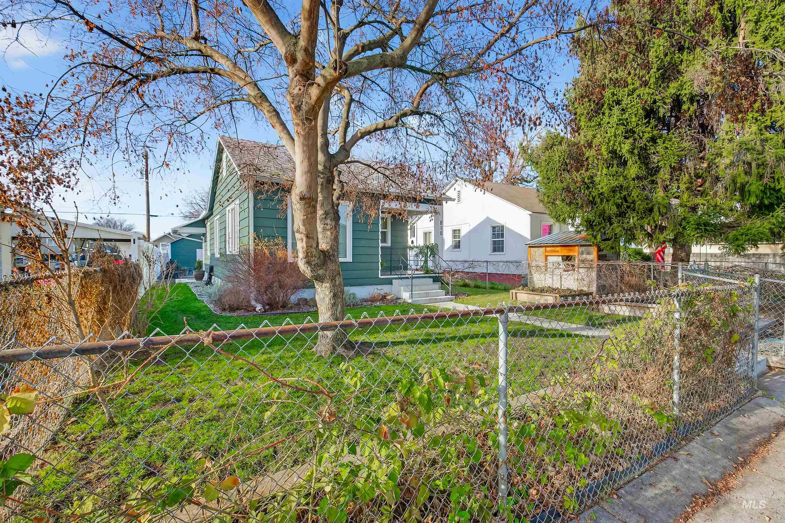 Bungalow-style home with a fenced front yard