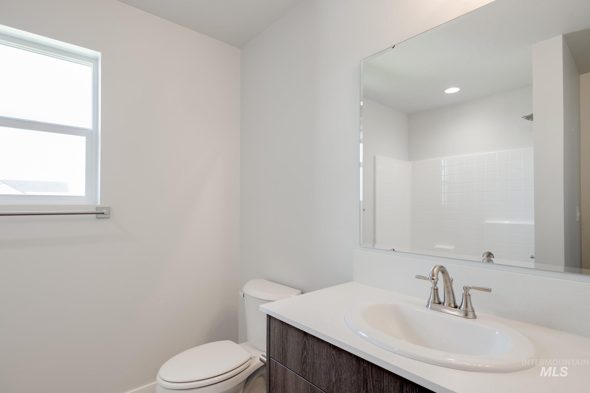 Full bath featuring vanity and a shower