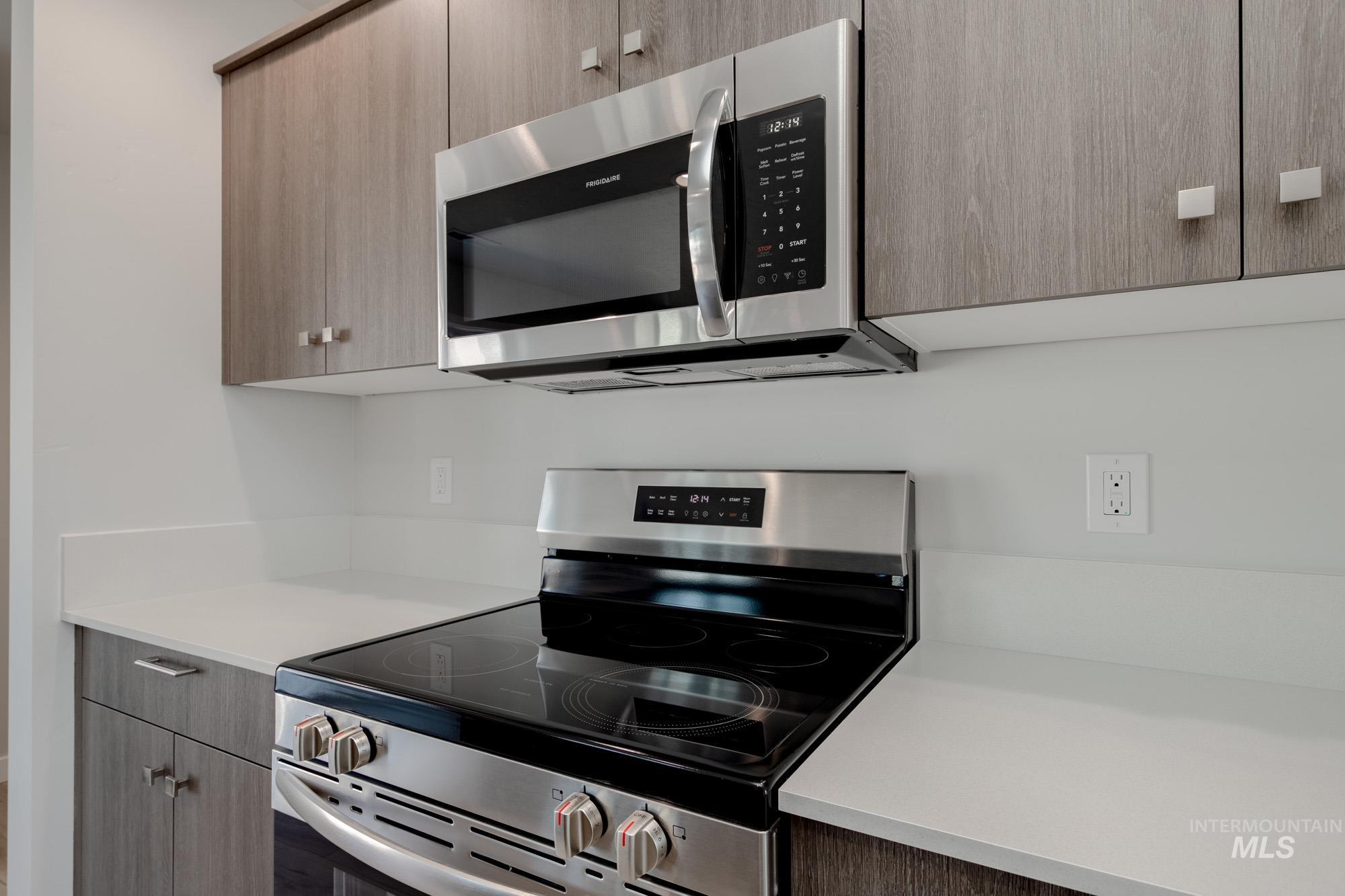 Kitchen with stainless steel appliances and modern cabinets