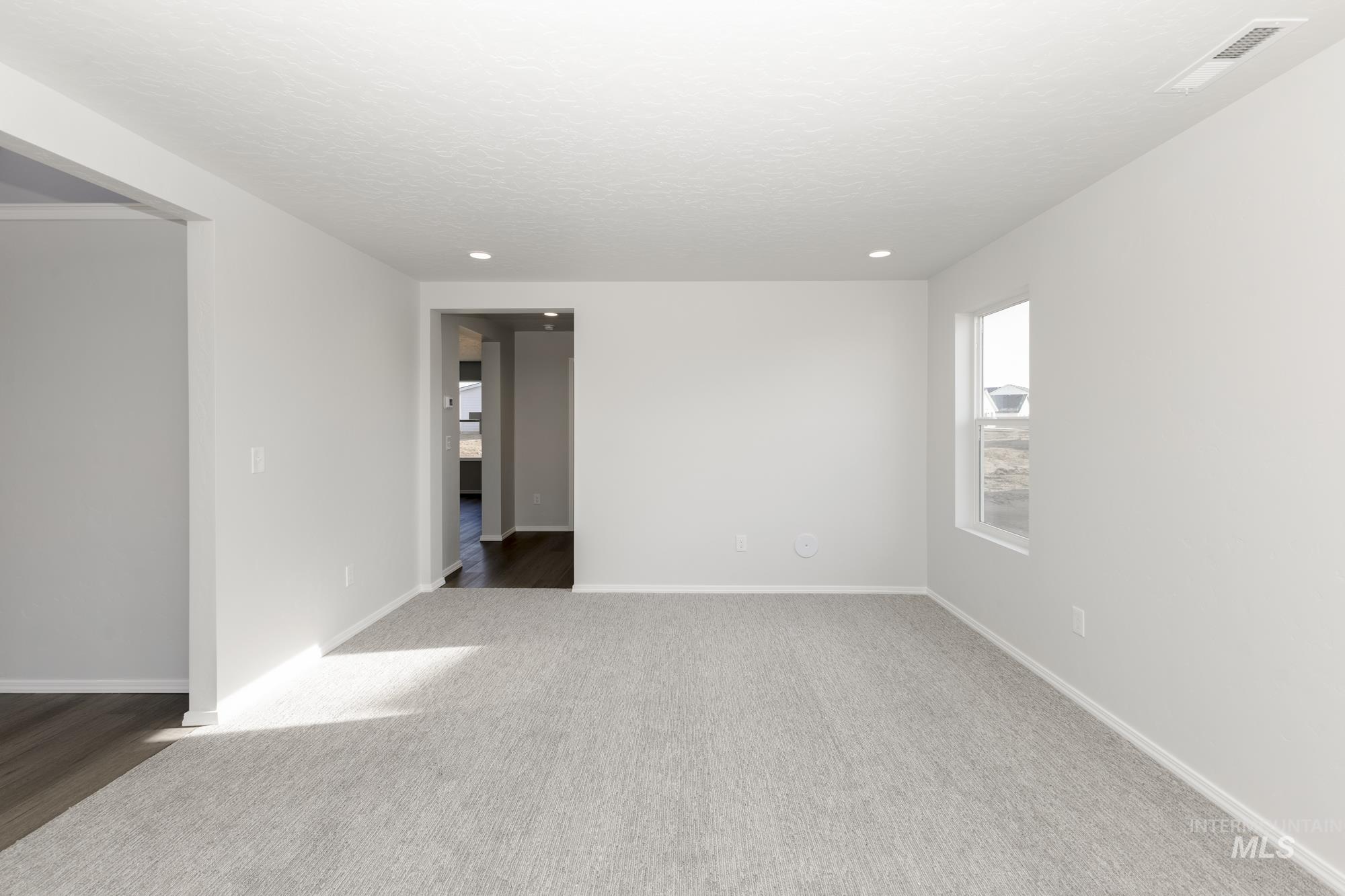 Empty room with baseboards and carpet floors