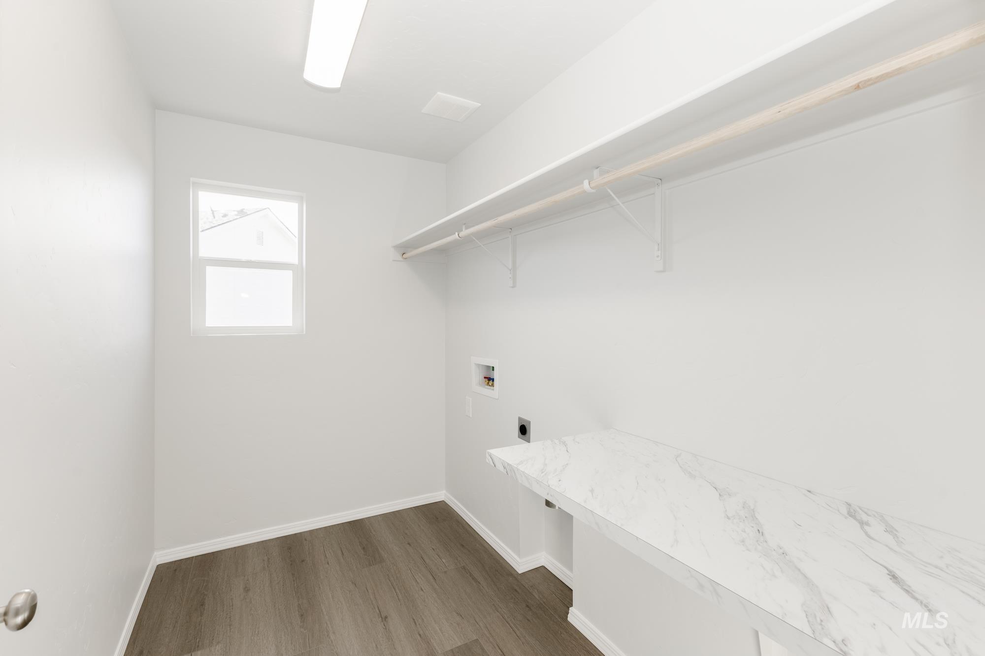 Laundry room with washer hookup, dark wood-style floors, and hookup for an electric dryer