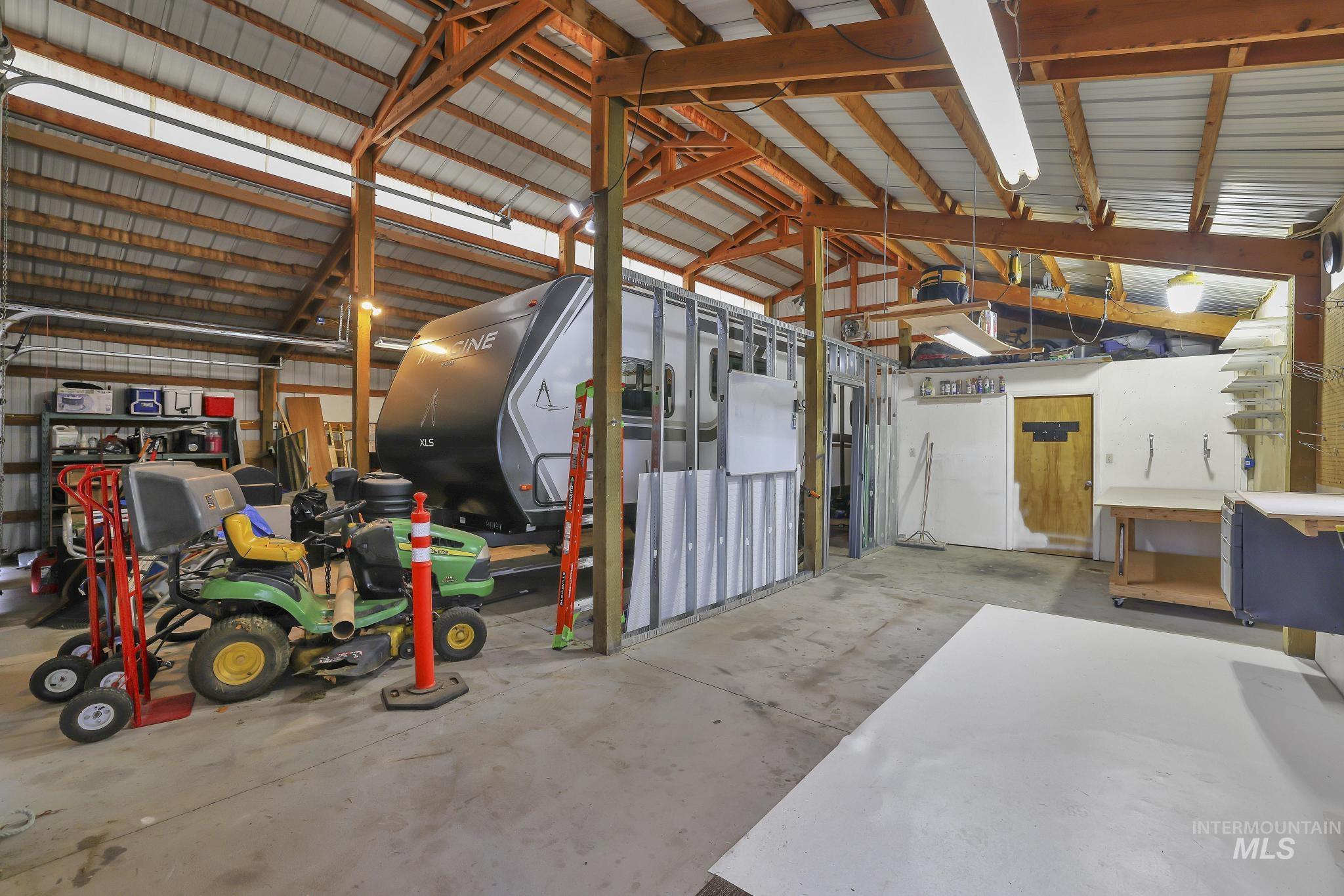 Garage with metal wall and a workshop area