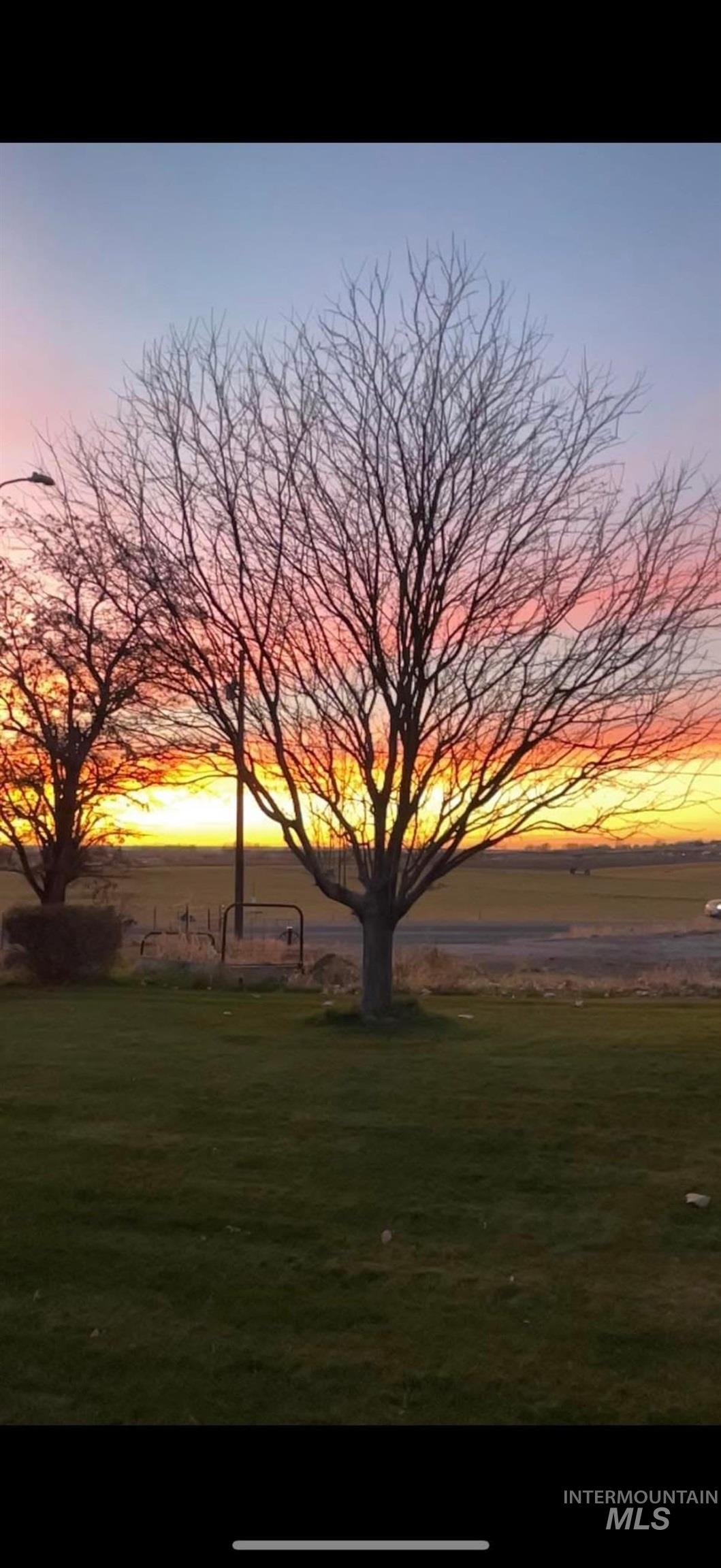 View of grassy yard with a water view