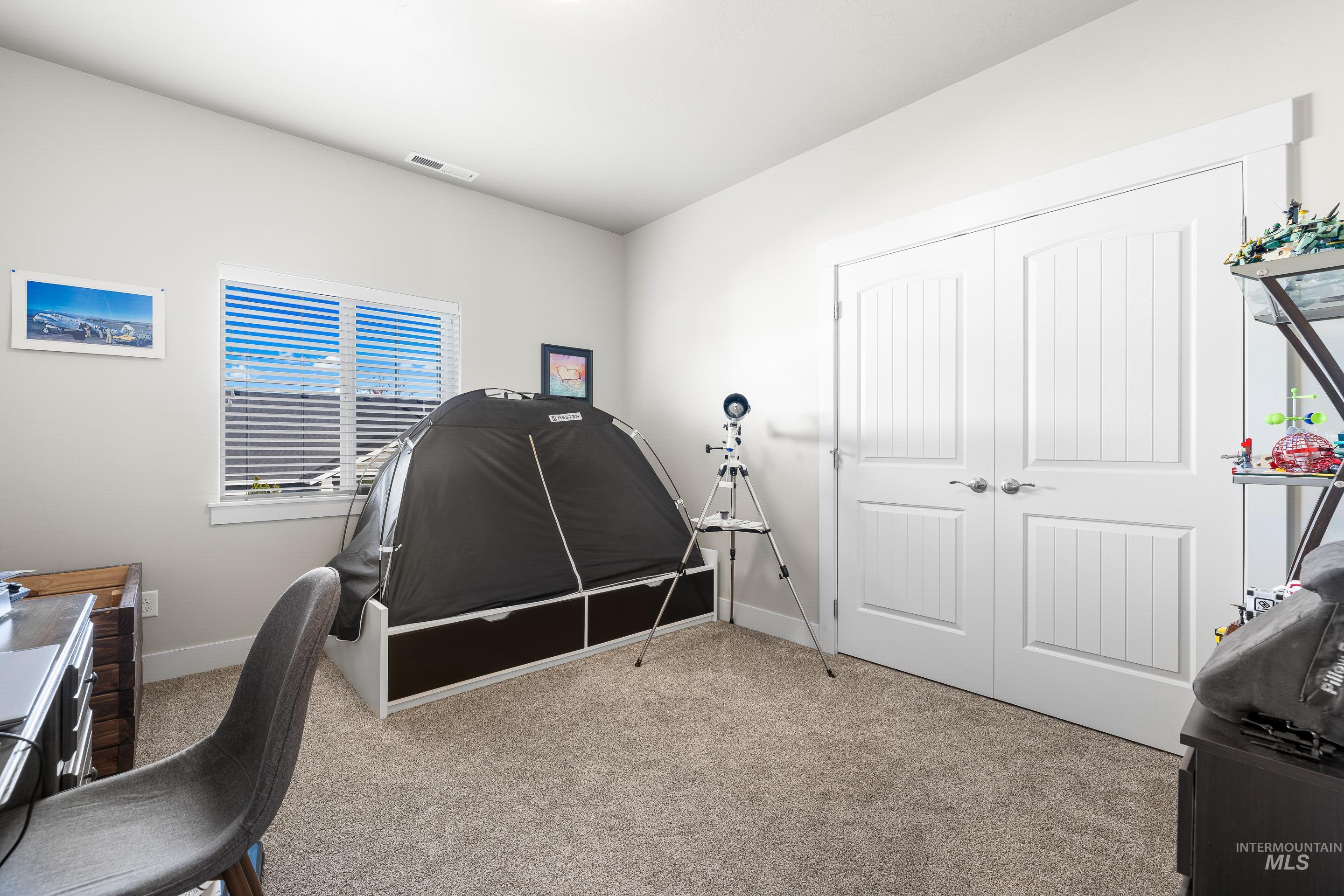 Office area with light carpet and baseboards