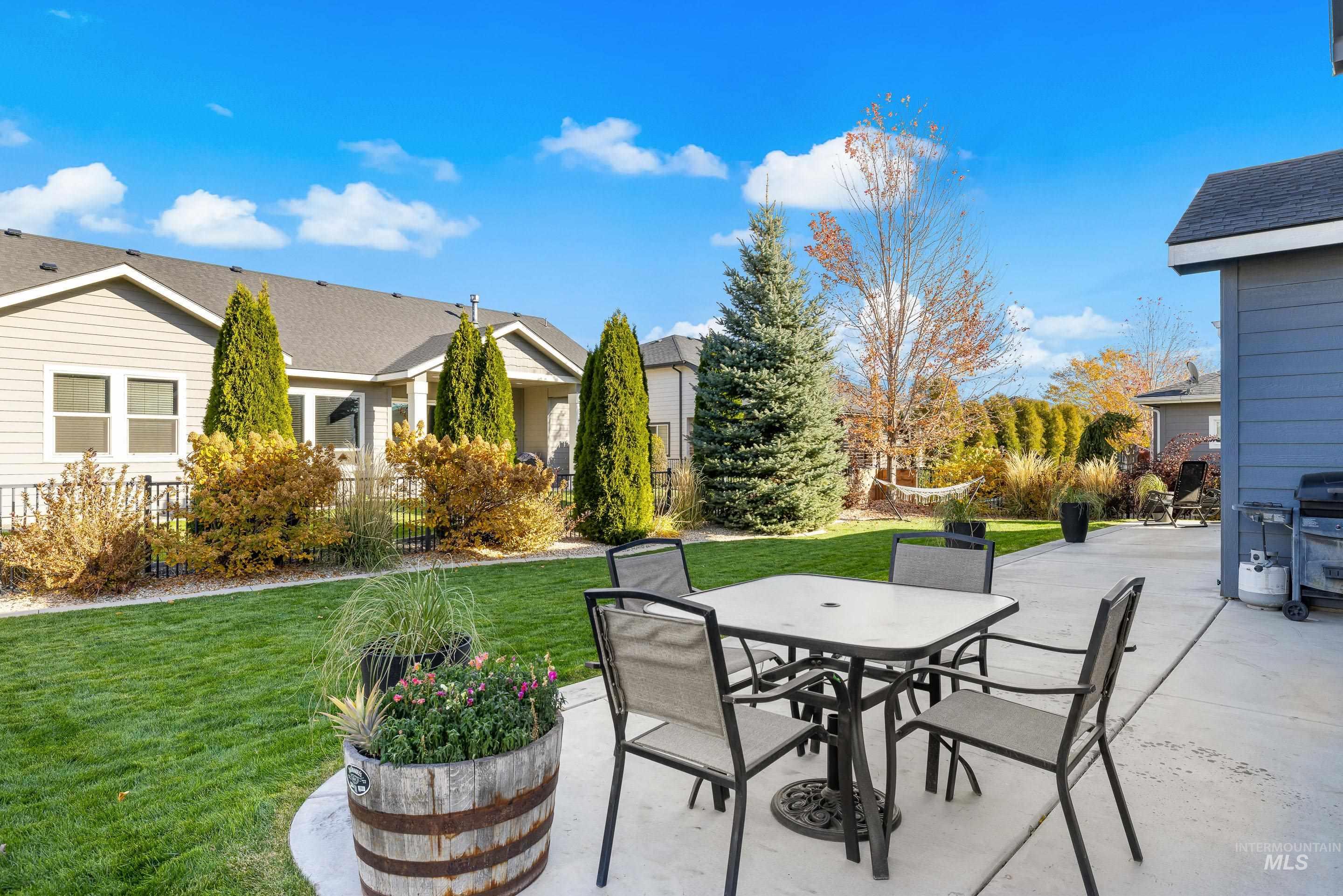 View of patio / terrace featuring grilling area, outdoor dining area, and a residential view