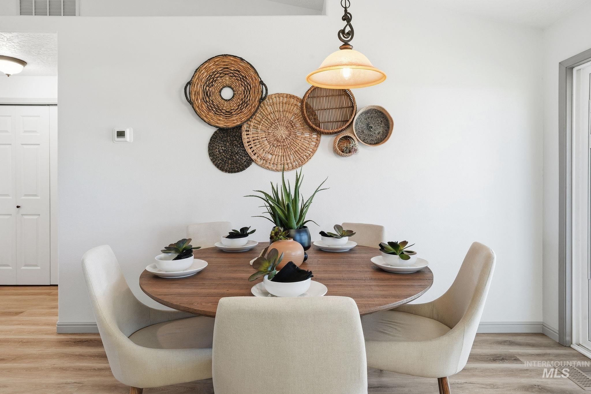 Dining area featuring light wood finished floors and baseboards