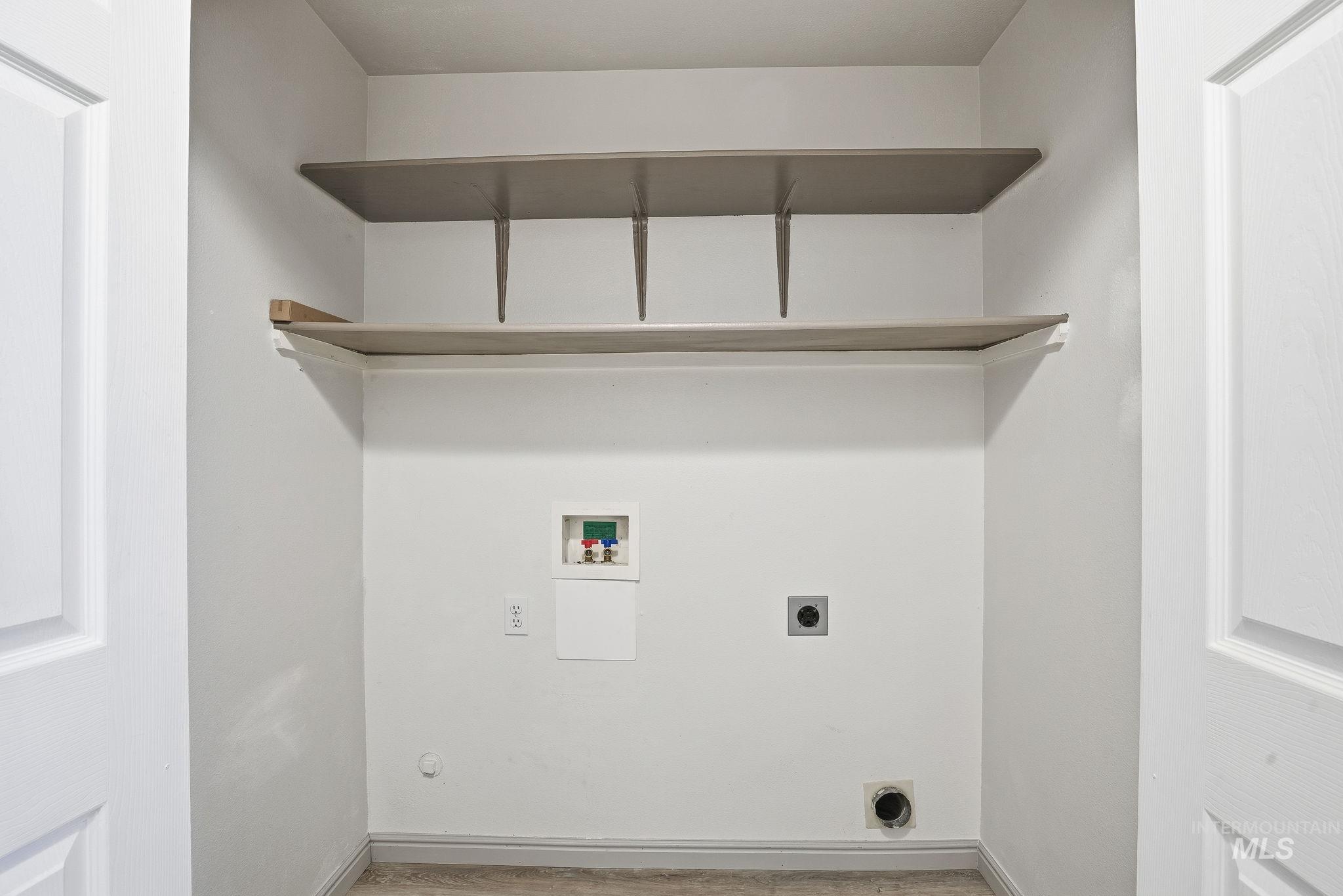 Laundry area with washer hookup and hookup for an electric dryer