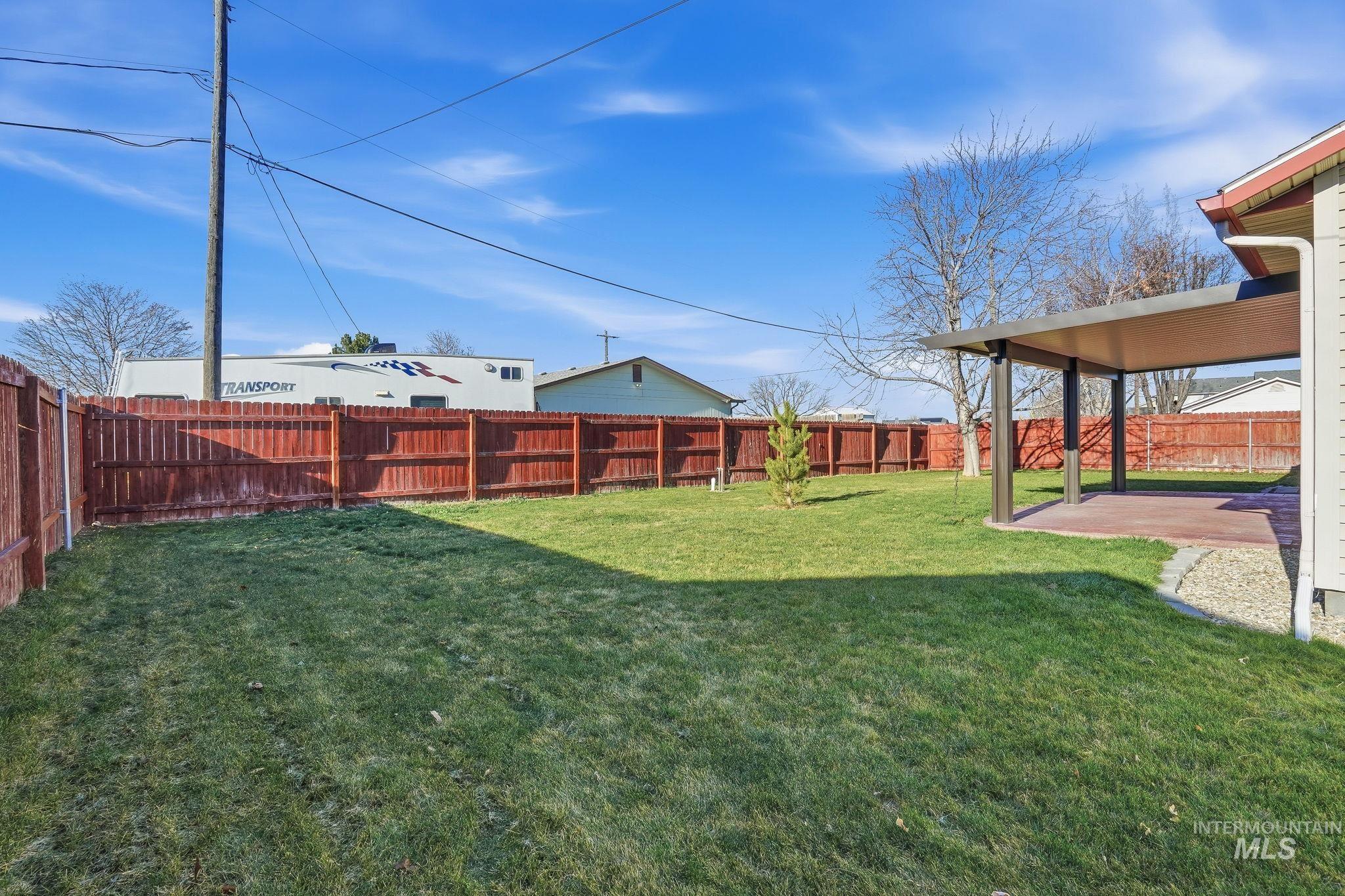 Fenced backyard featuring a patio area