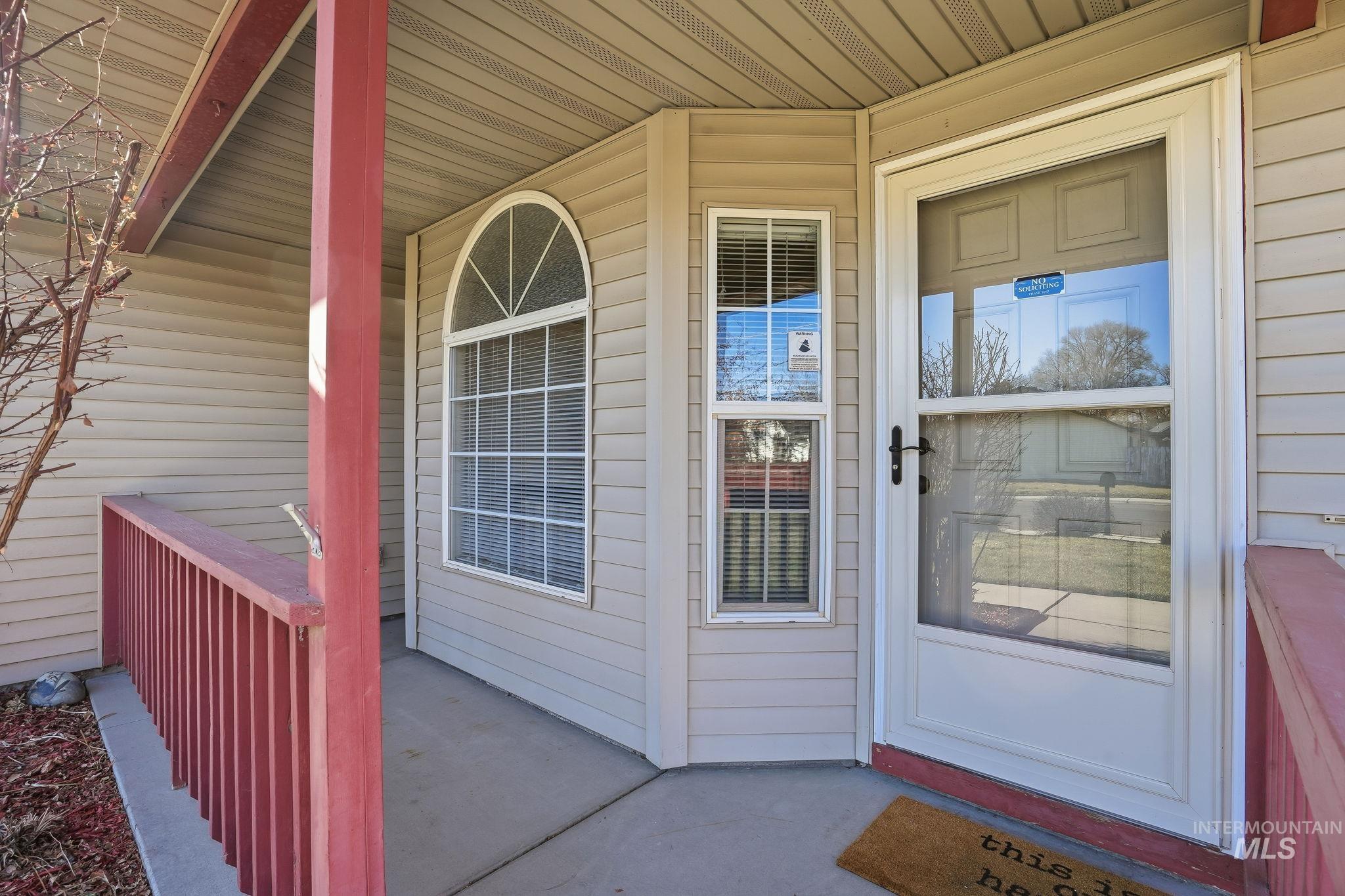Entrance to property featuring a porch