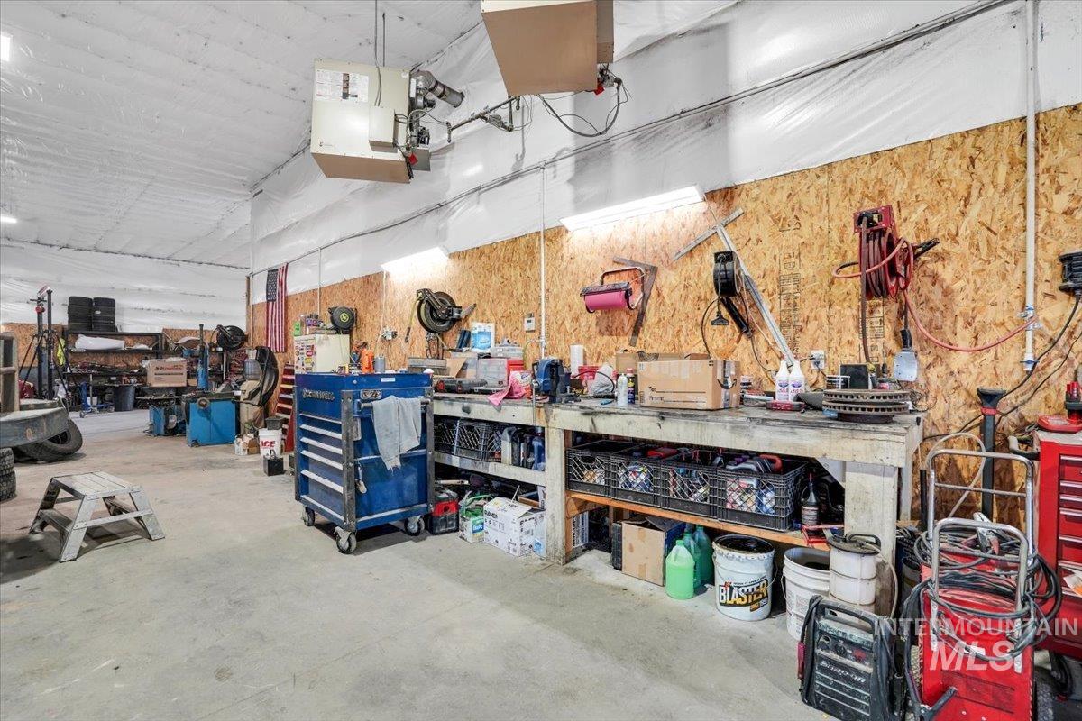 Garage featuring a heating unit