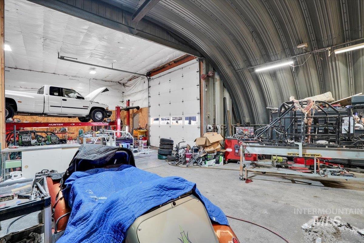 Garage with metal wall and a workshop area