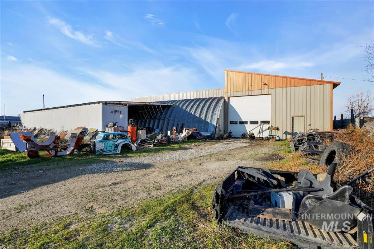 View of pole building with driveway