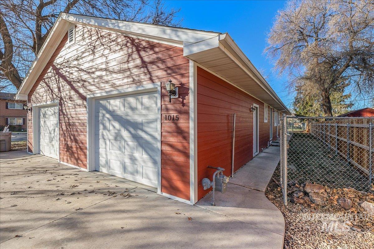 View of side of property with an outdoor structure