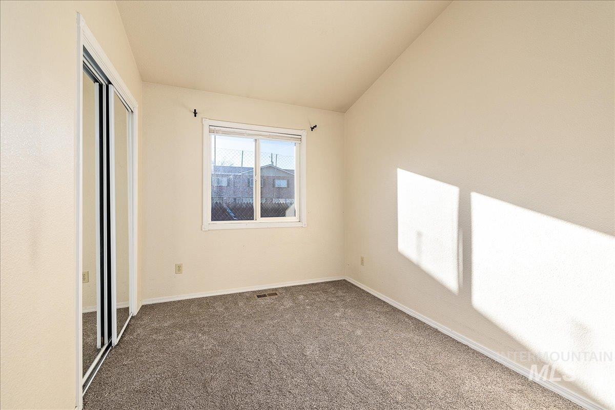 Unfurnished bedroom with carpet floors and a closet