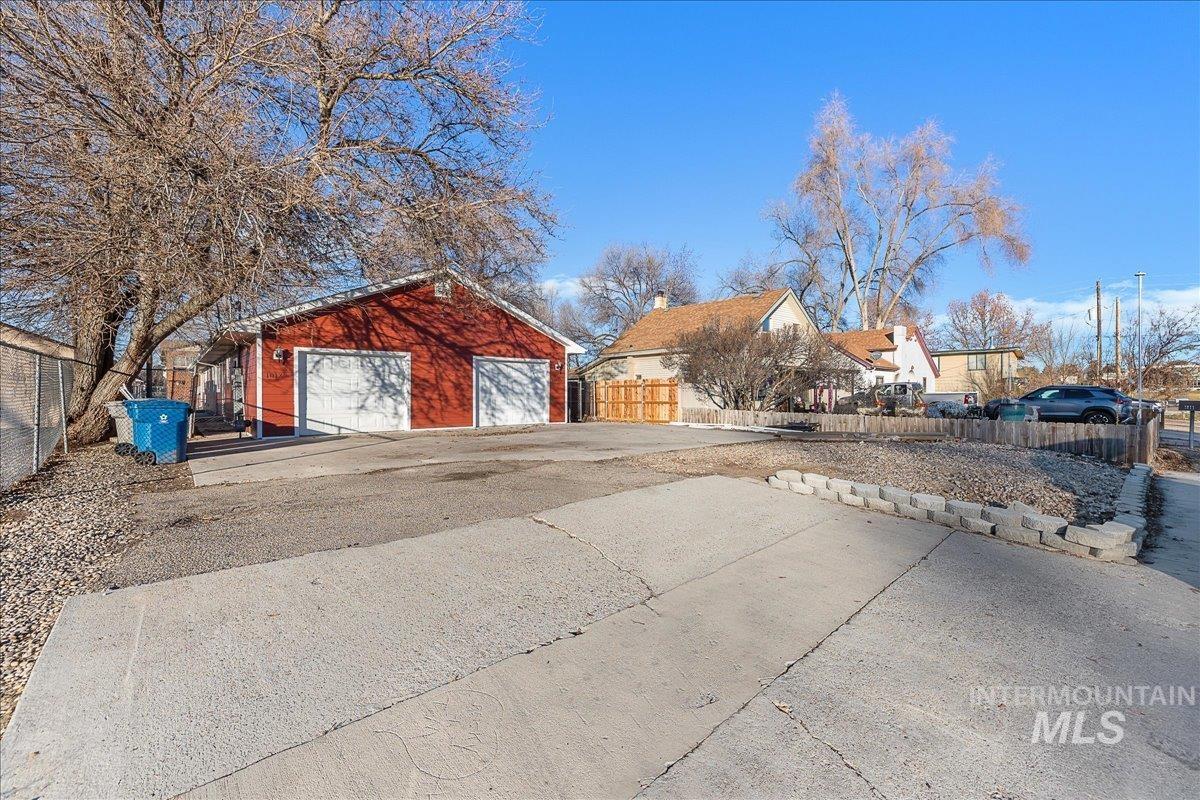 Detached garage with a residential view