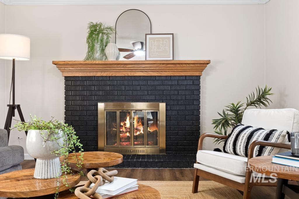 Detailed view of a fireplace and wood finished floors