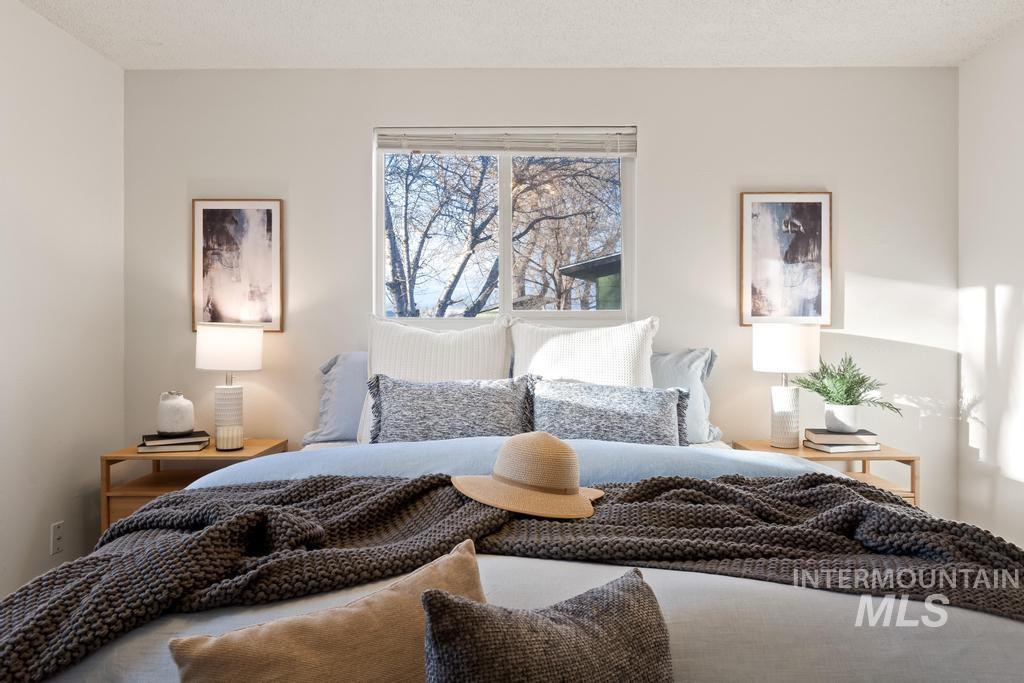 Bedroom with a textured ceiling