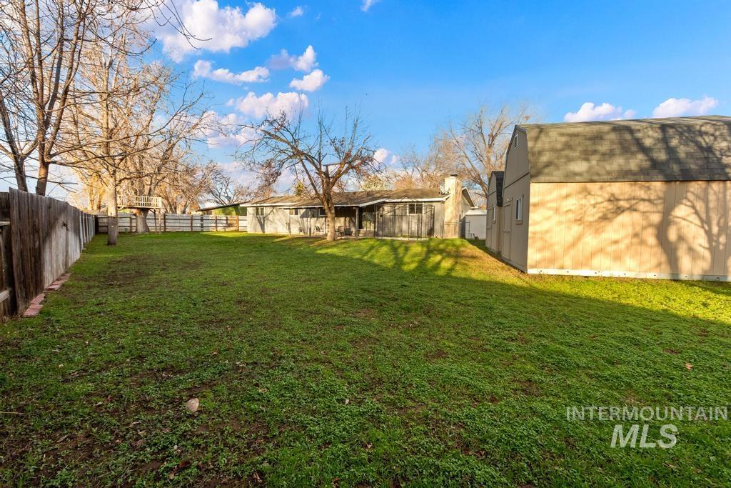 View of fenced backyard