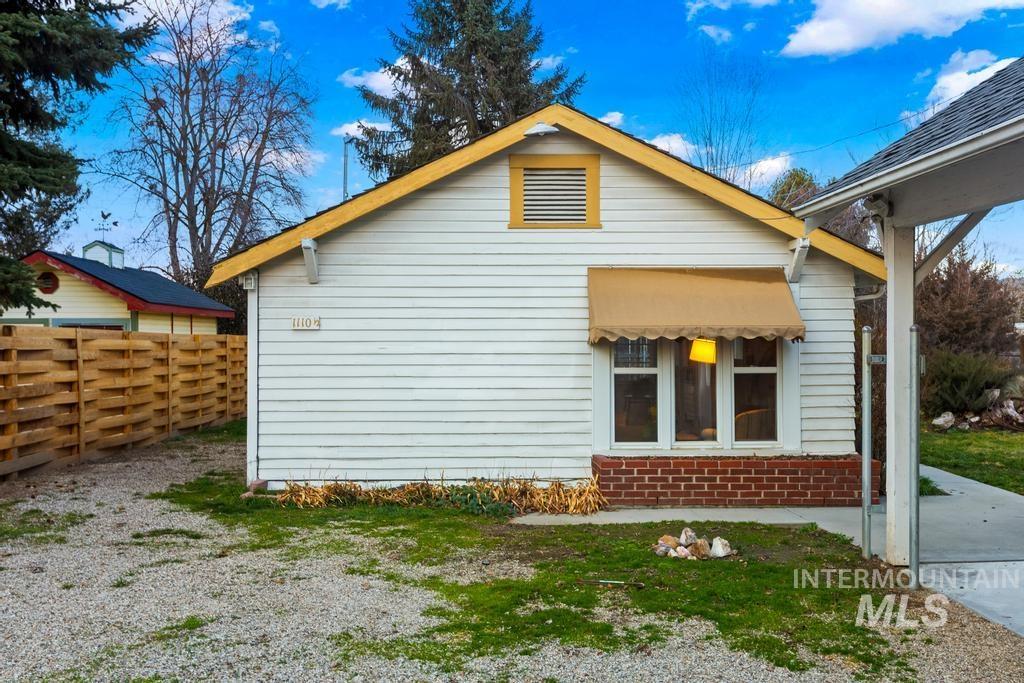 View of side of home with brick siding