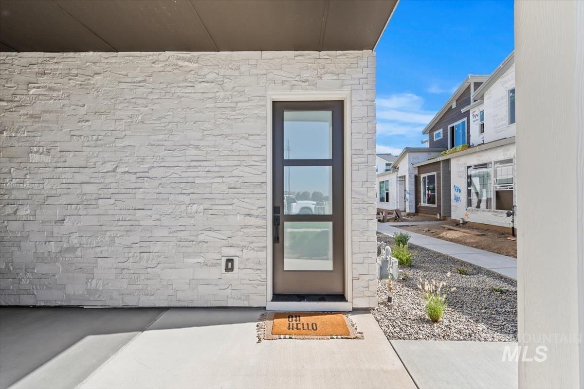 View of exterior entry with stone siding