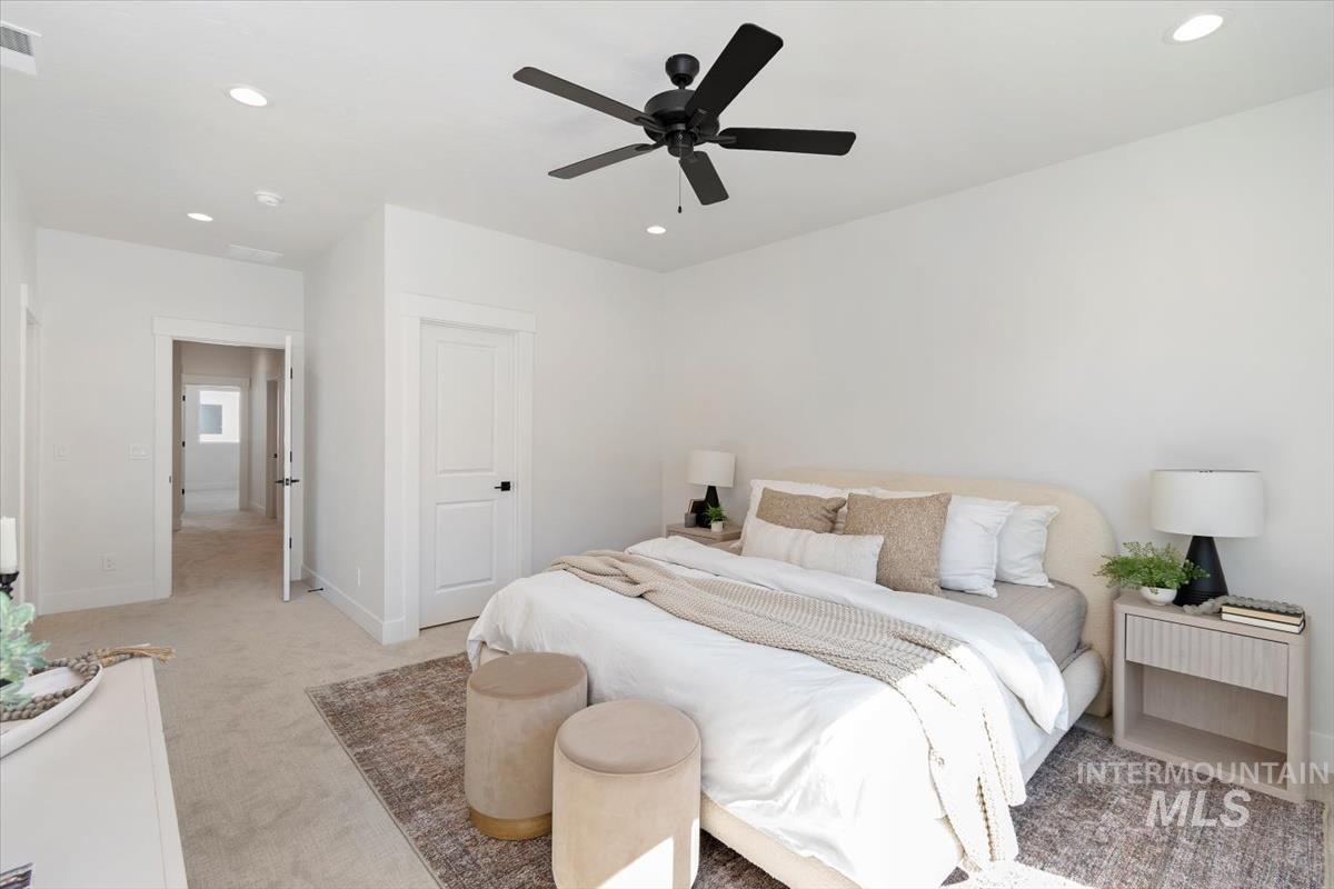 Bedroom featuring recessed lighting, carpet flooring, and ceiling fan