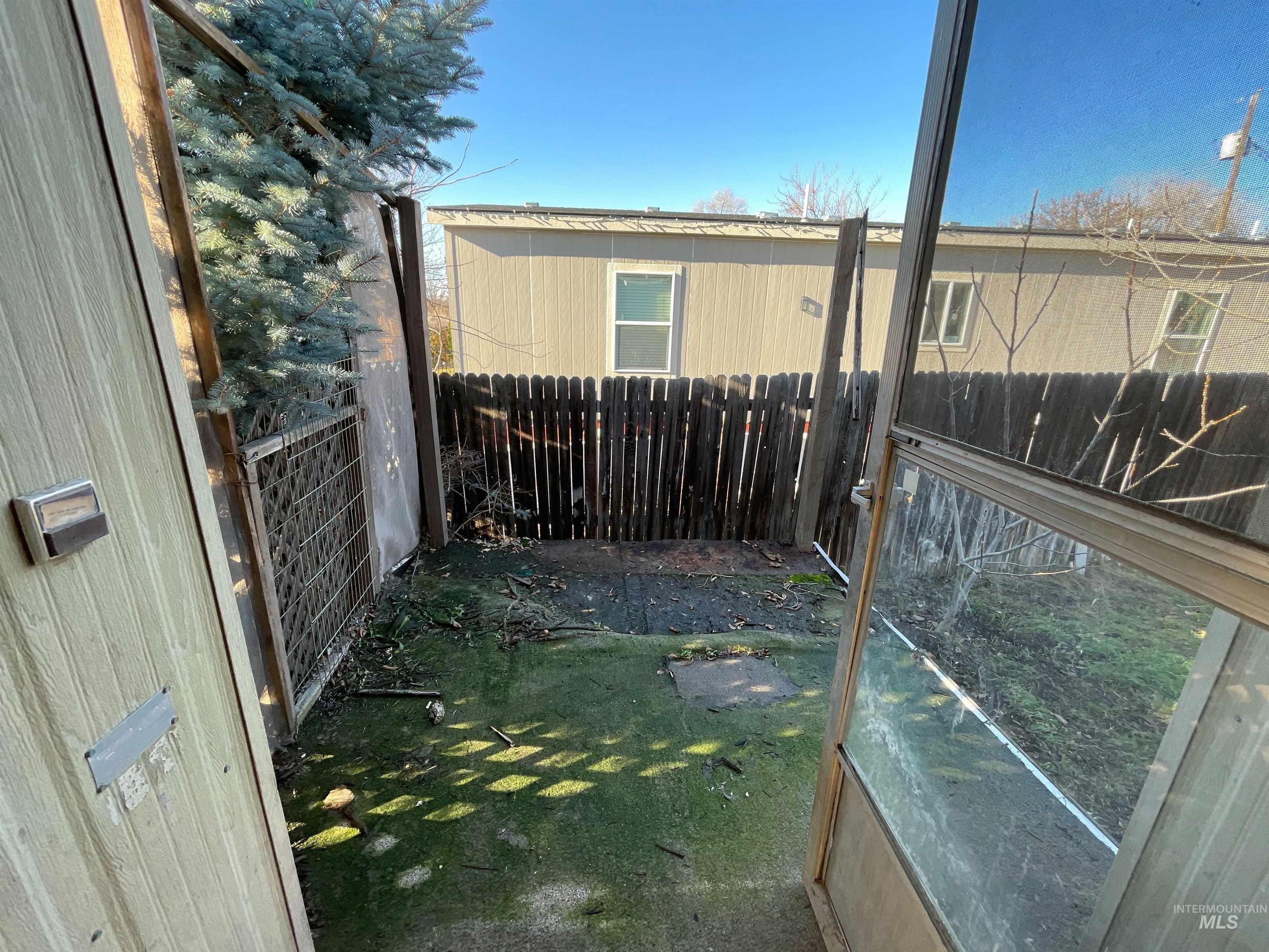 View of fenced backyard