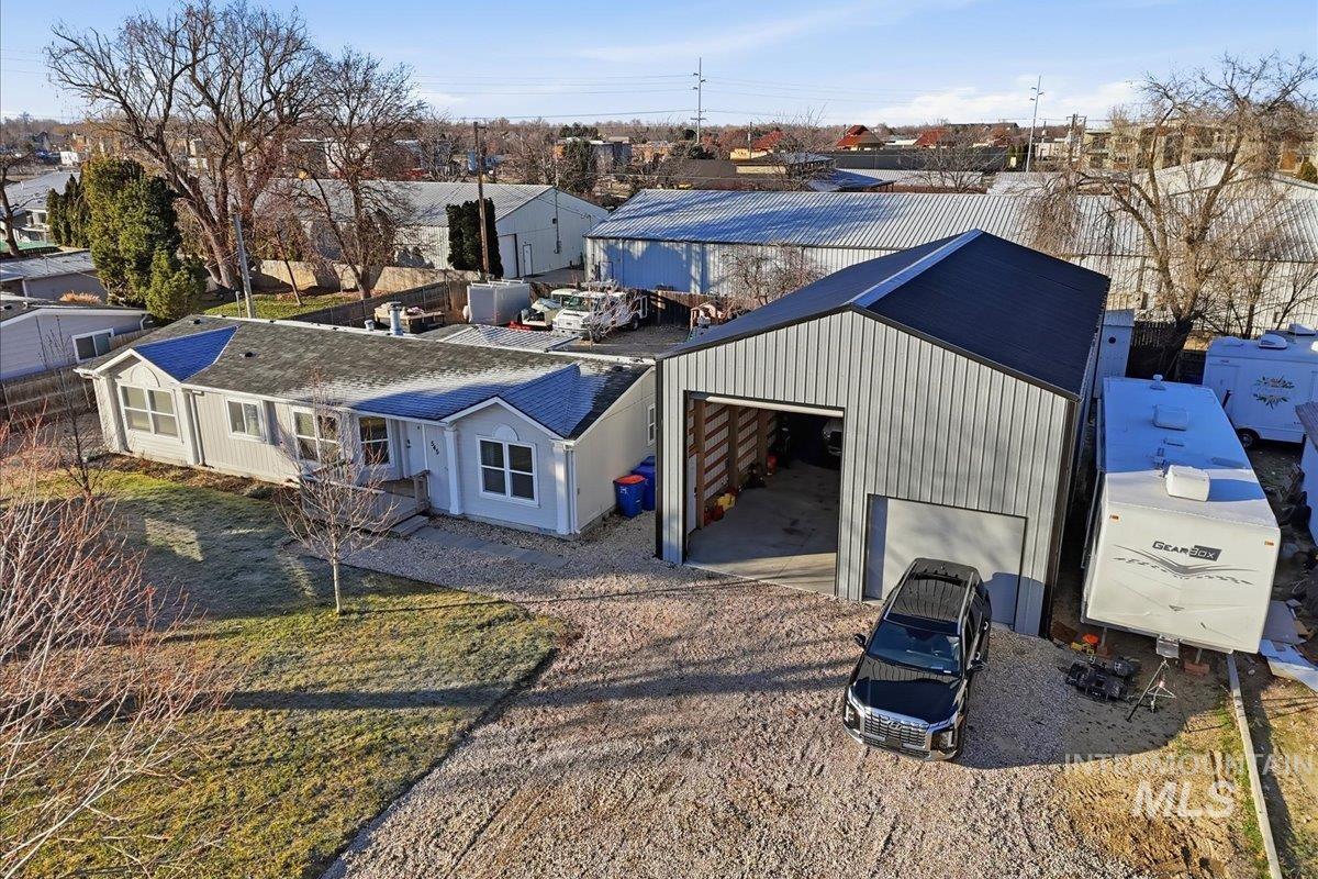 Rear view of property with driveway and a residential view