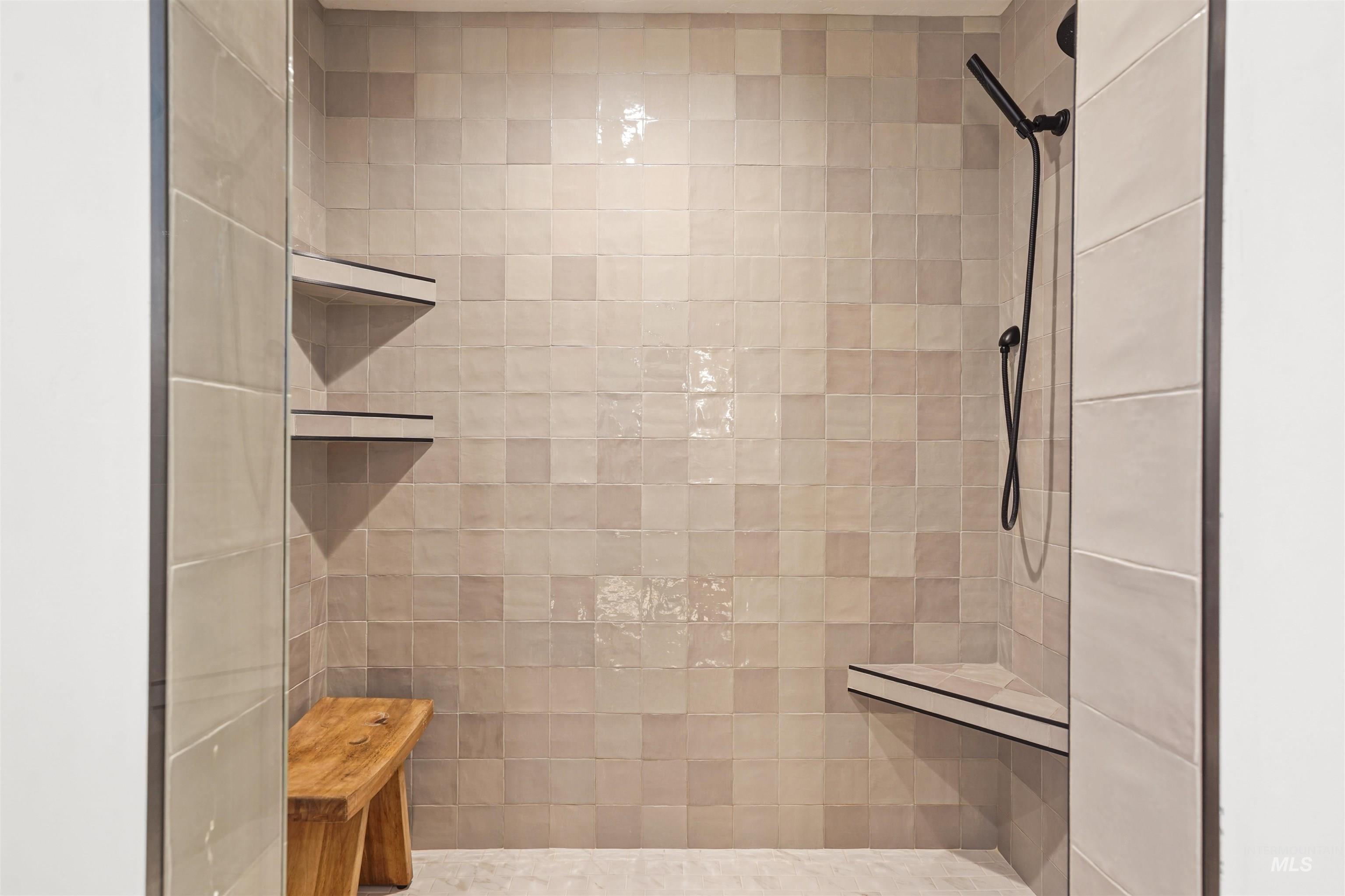Full bathroom featuring a tile shower