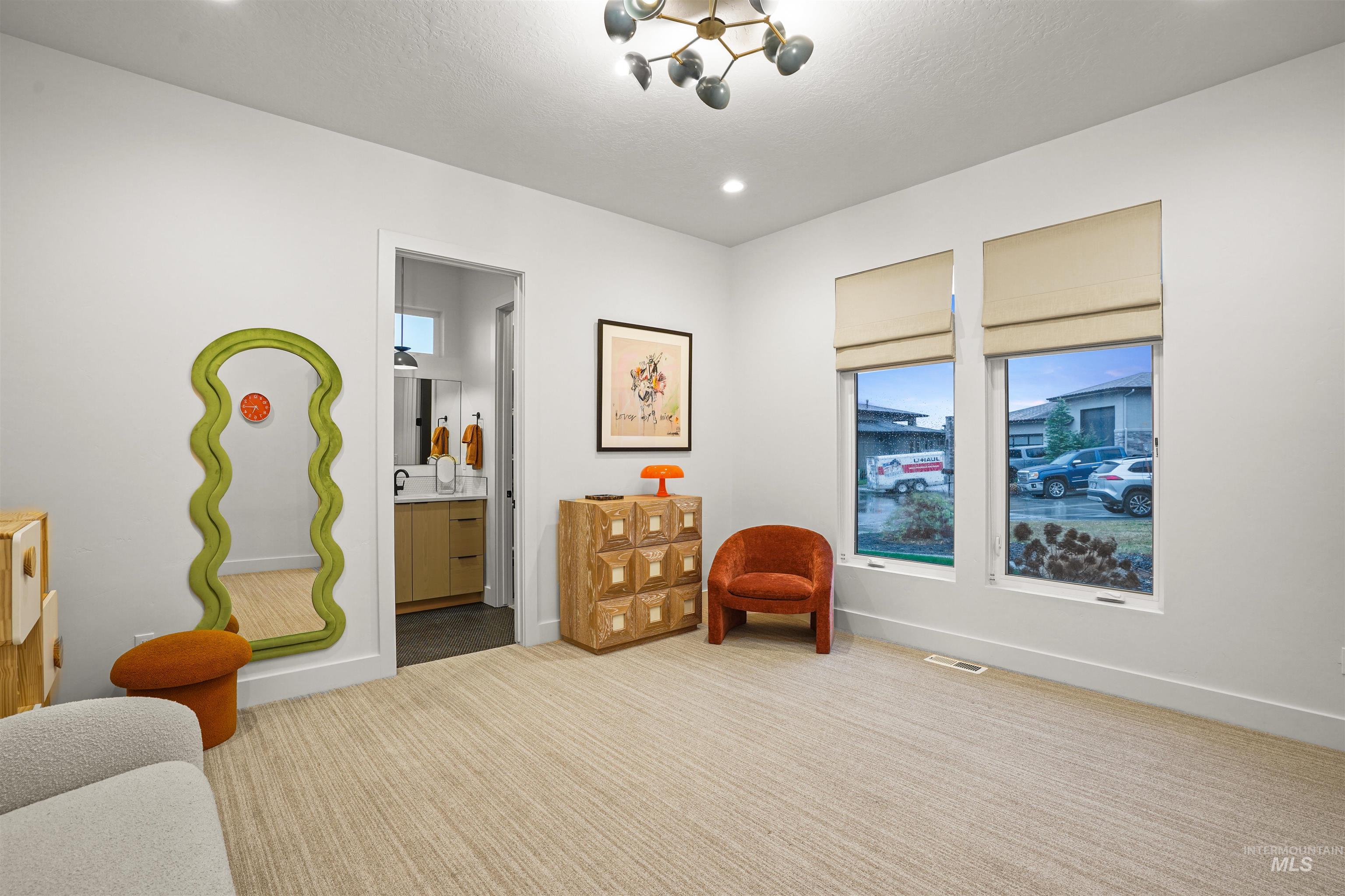 Sitting room featuring carpet floors and recessed lighting