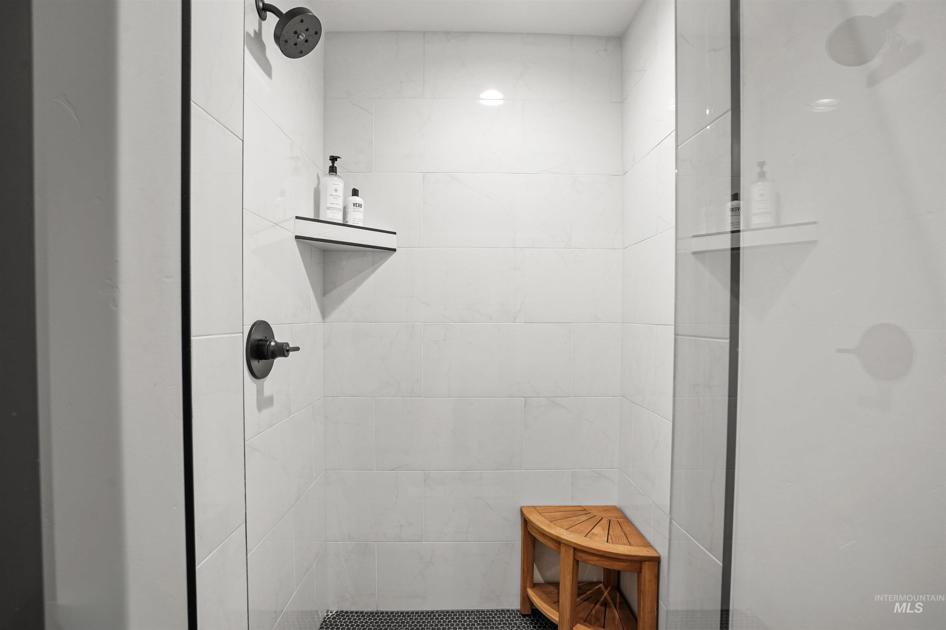 Full bath with a shower stall