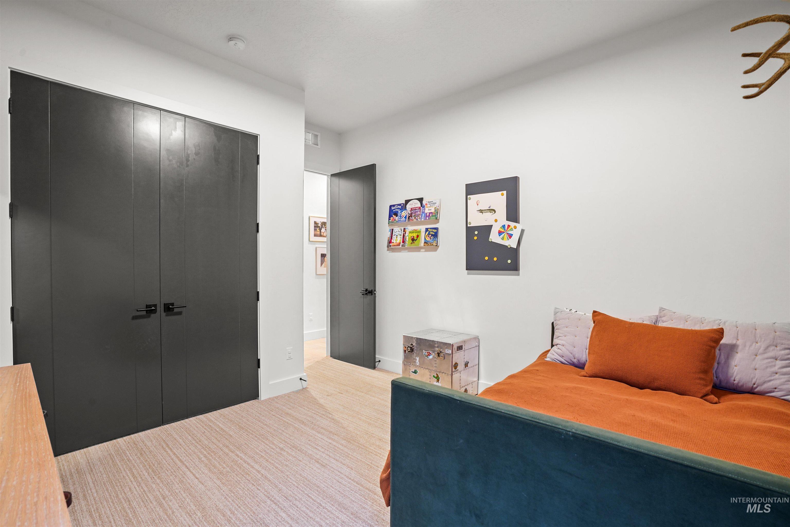 Bedroom featuring a closet and baseboards