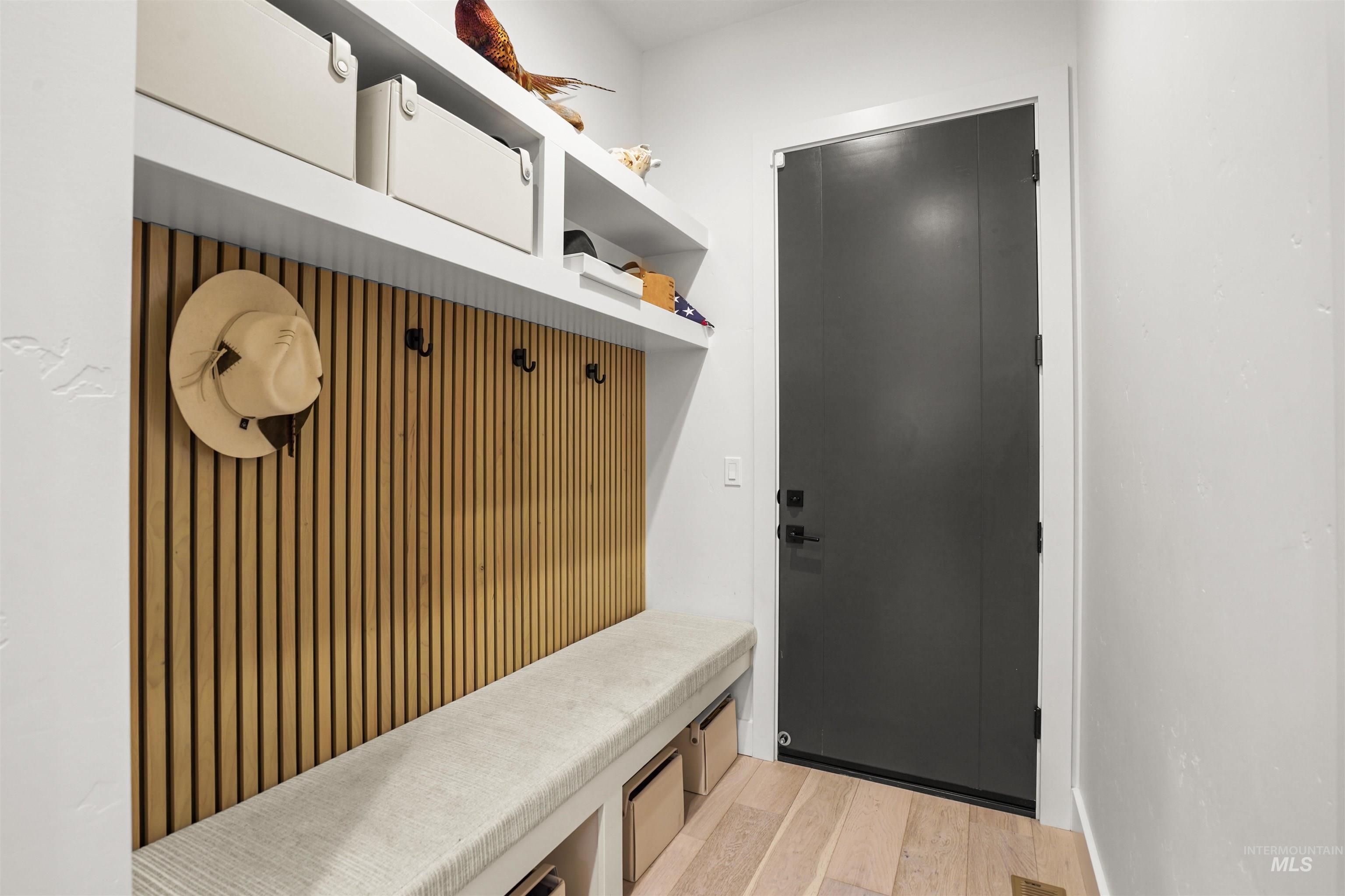 Mudroom with light wood-type flooring