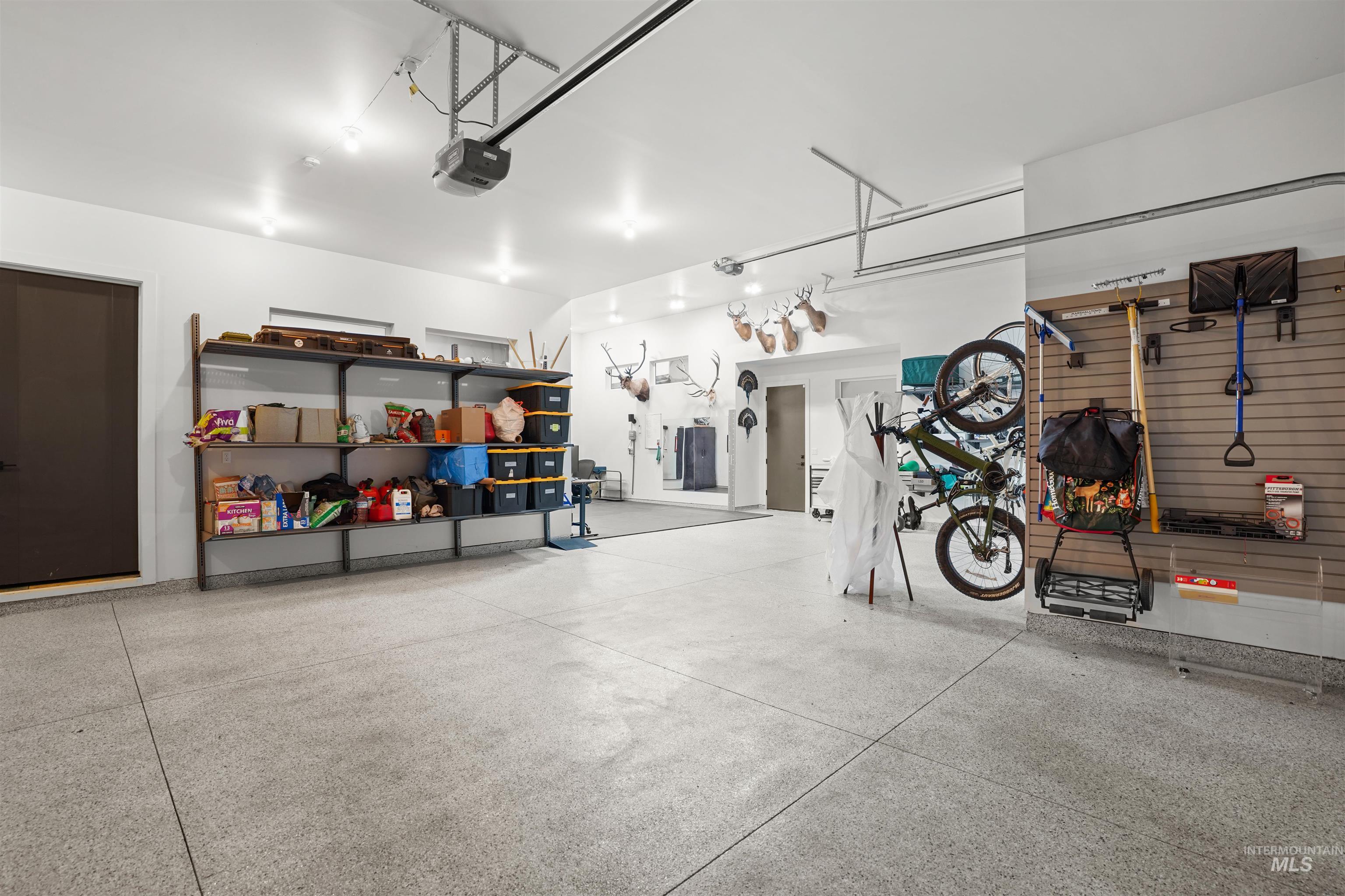 Garage featuring a garage door opener