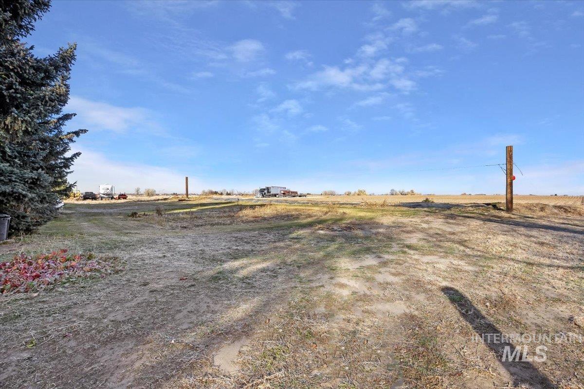 View of yard with a rural view