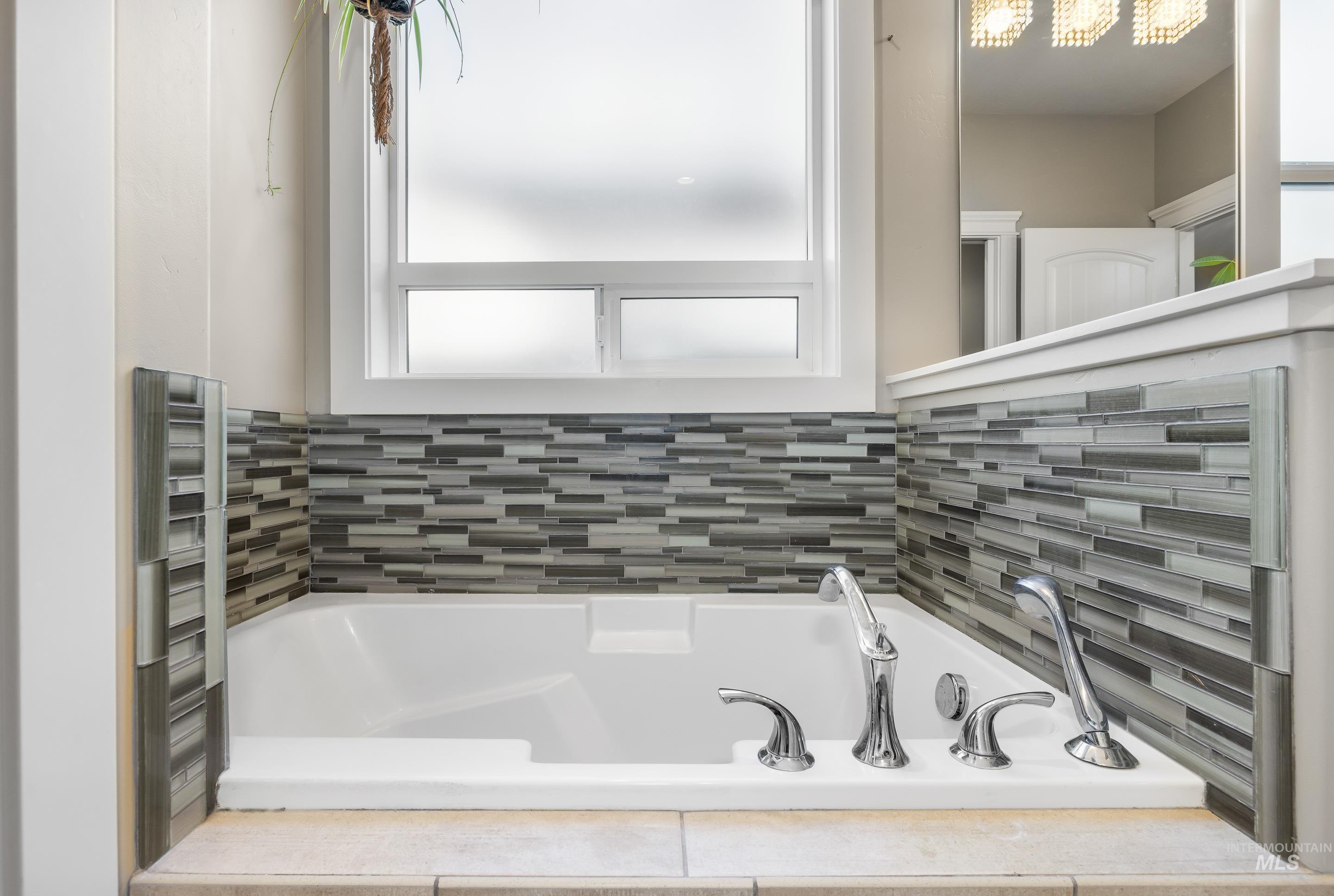 Full bathroom featuring a bath and radiator