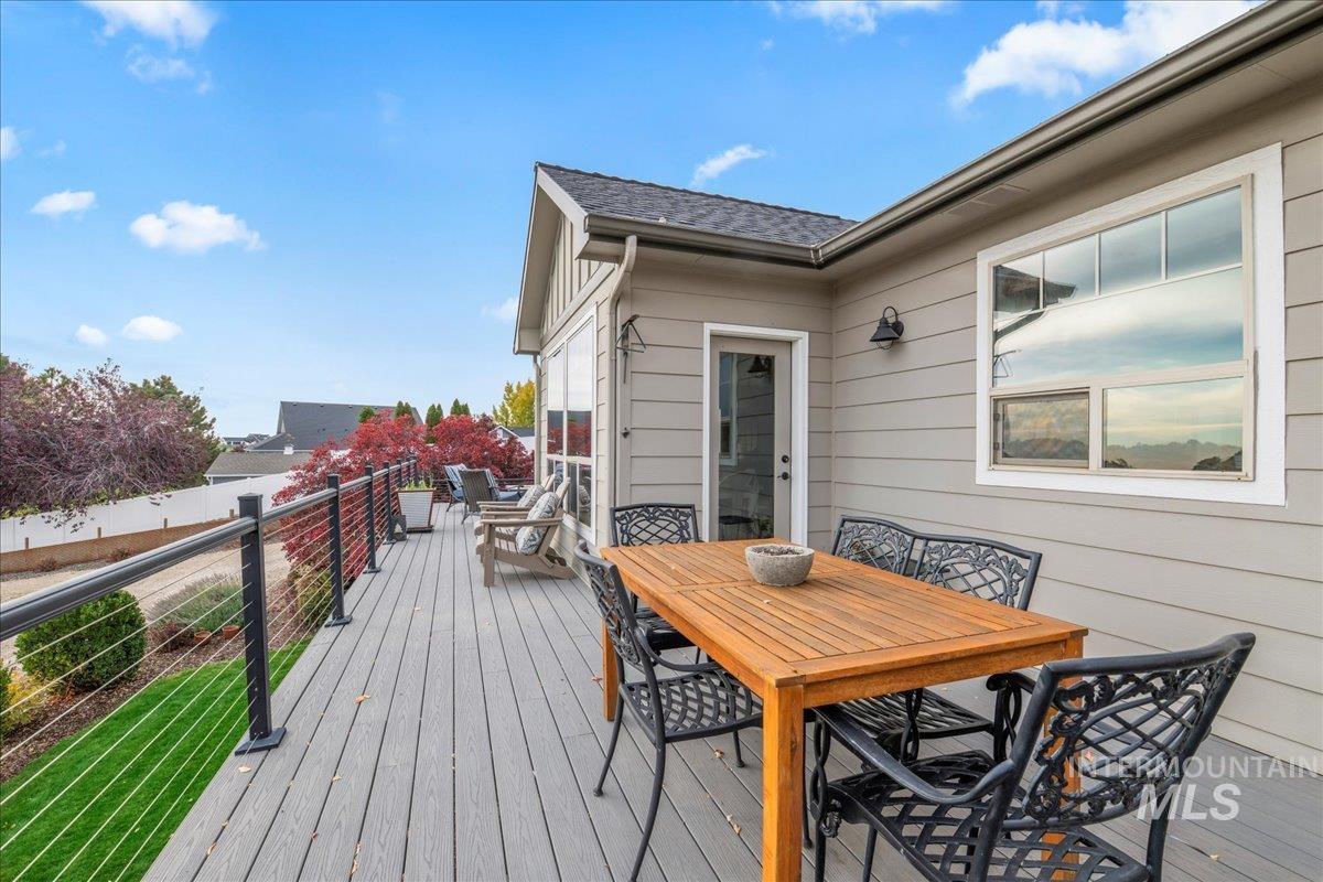 Wooden deck featuring outdoor dining area