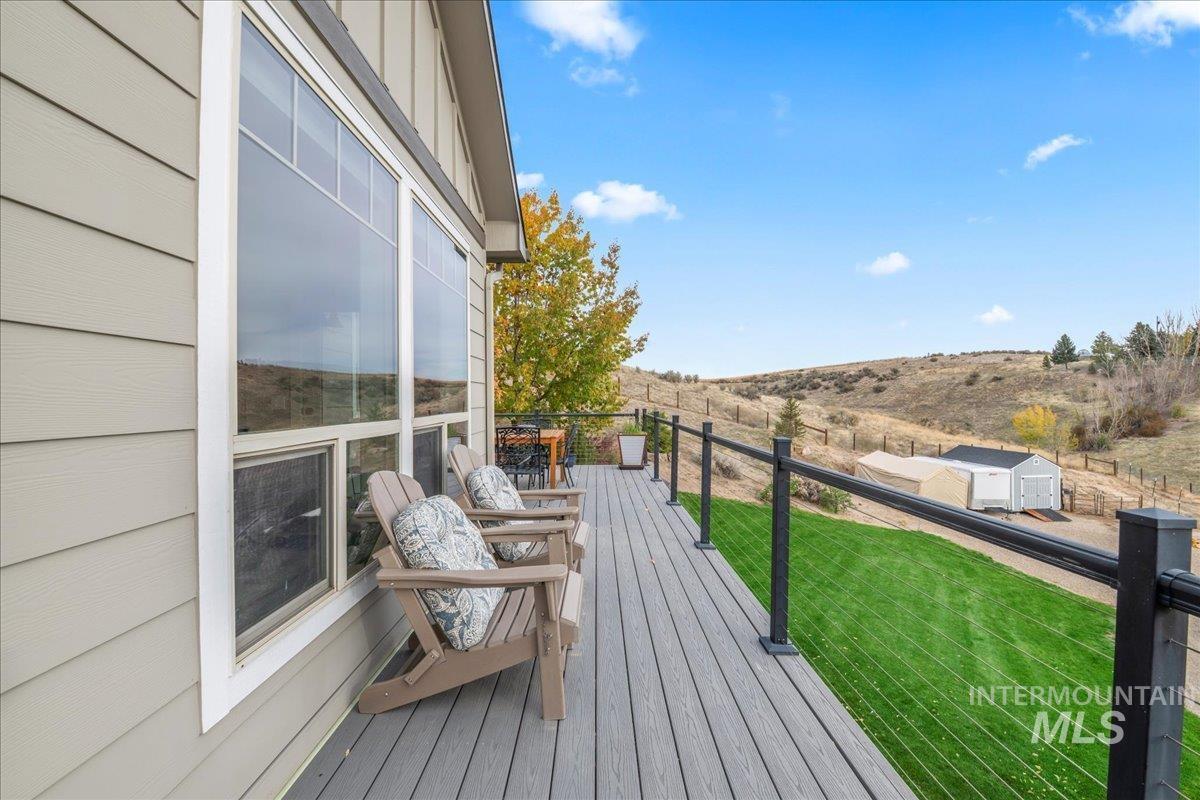 Deck with a lawn and a view of rural / pastoral area