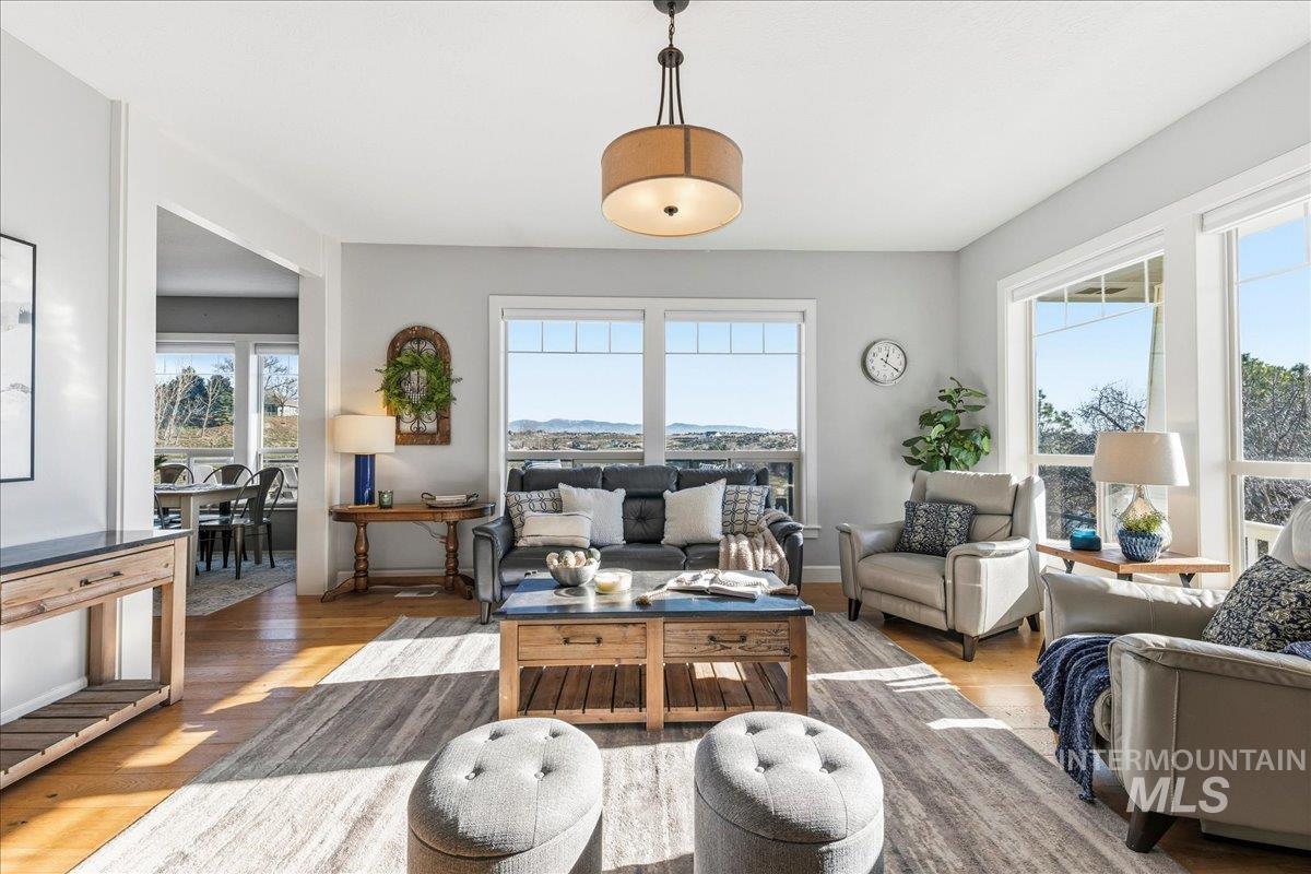 Living room featuring light wood-style floors and baseboards
