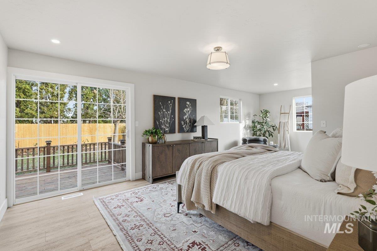 Downstairs Primary with en-suite and walk-in closet leading out to back deck
