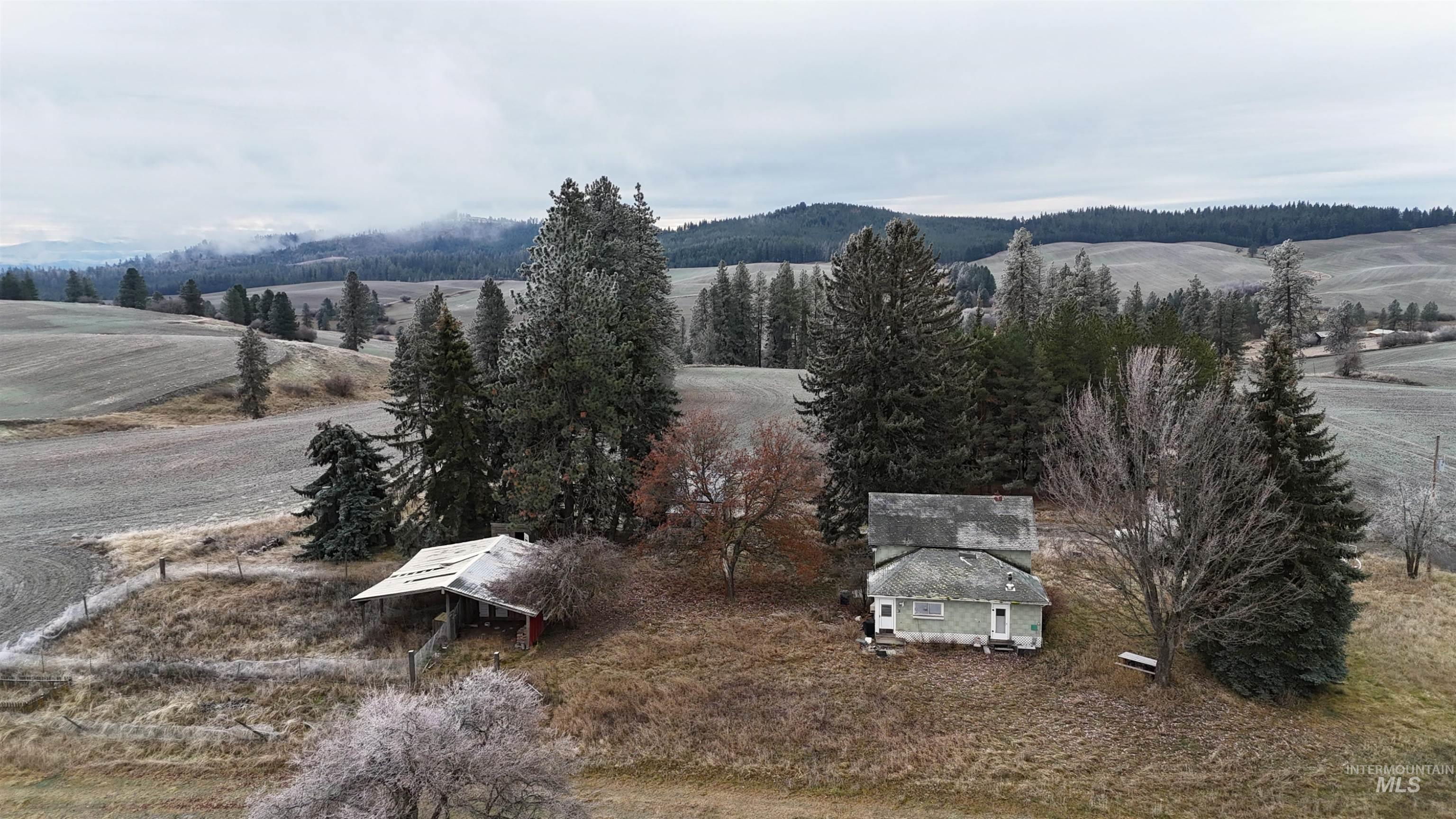 View of mountain backdrop featuring rural landscape