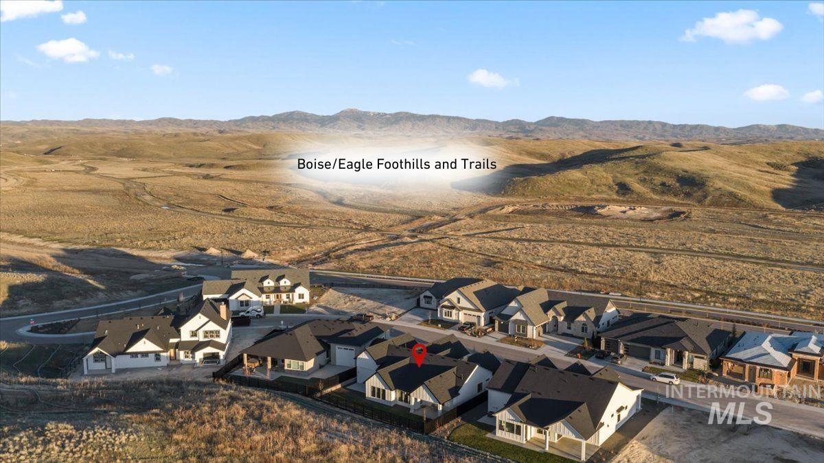 Aerial perspective of suburban area featuring a mountainous background